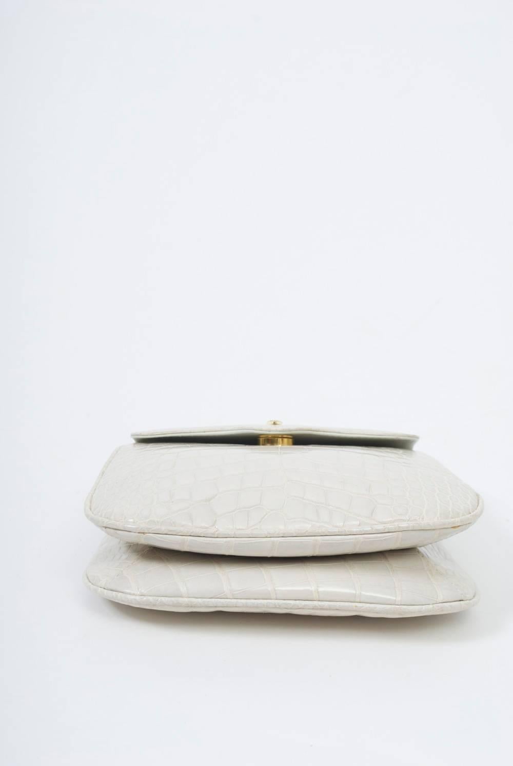 Pristine Lana of London white alligator convertible clutch featuring two different shoulder straps, one in matching skin, the other beaded with tassel. Interior with double-section interior. Original box. A very special opportunity.