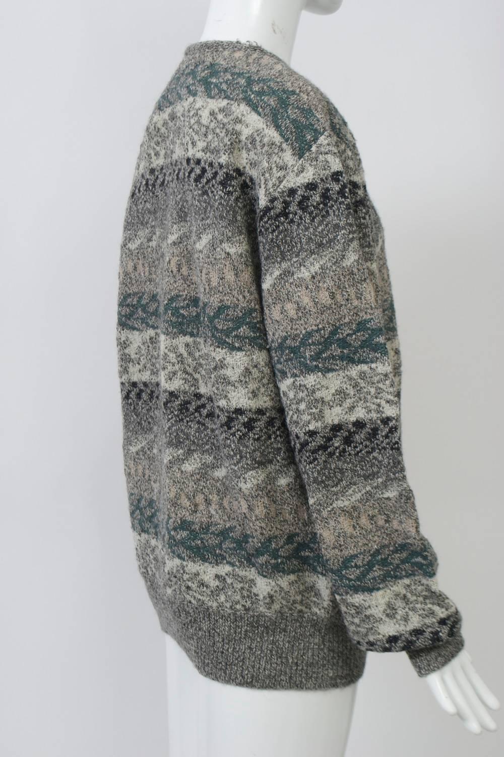 Classic Missoni men's pullover featuring a complicated intarsia design in subtle colors of mostly beiges and grays highlighted by teal. Fabric is a soft blend of alpaca, wool and nylon. 