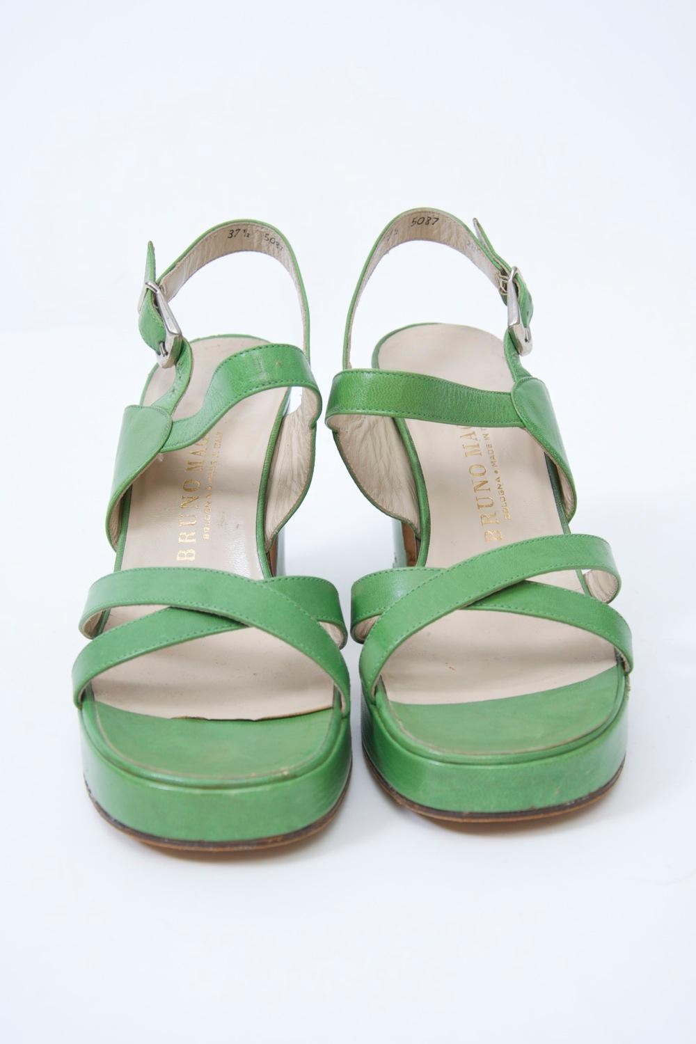 Iconic 1970s platform sandals by Bruno Magli in bright green leather featuring crossed straps in front, a buckled strap in back, and a 3 1/2