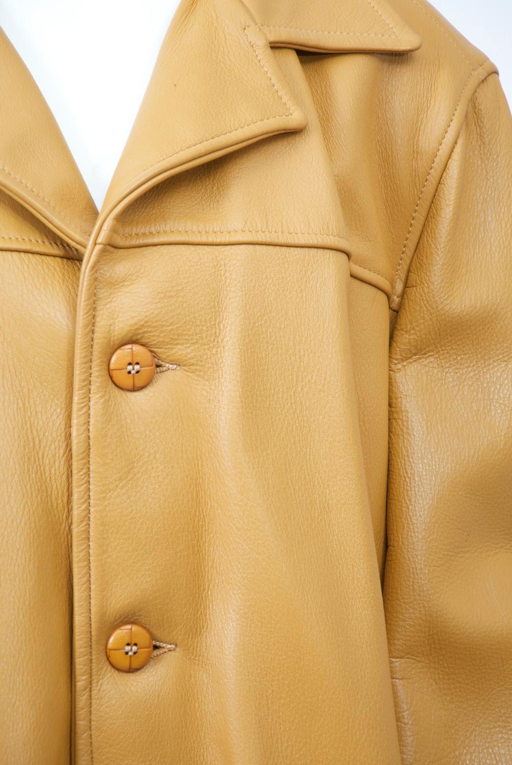 Men's western style jacket in buttery deerskin featuring patch pockets and yoke detail, as well as button cuffs. Single breasted with spread collar.