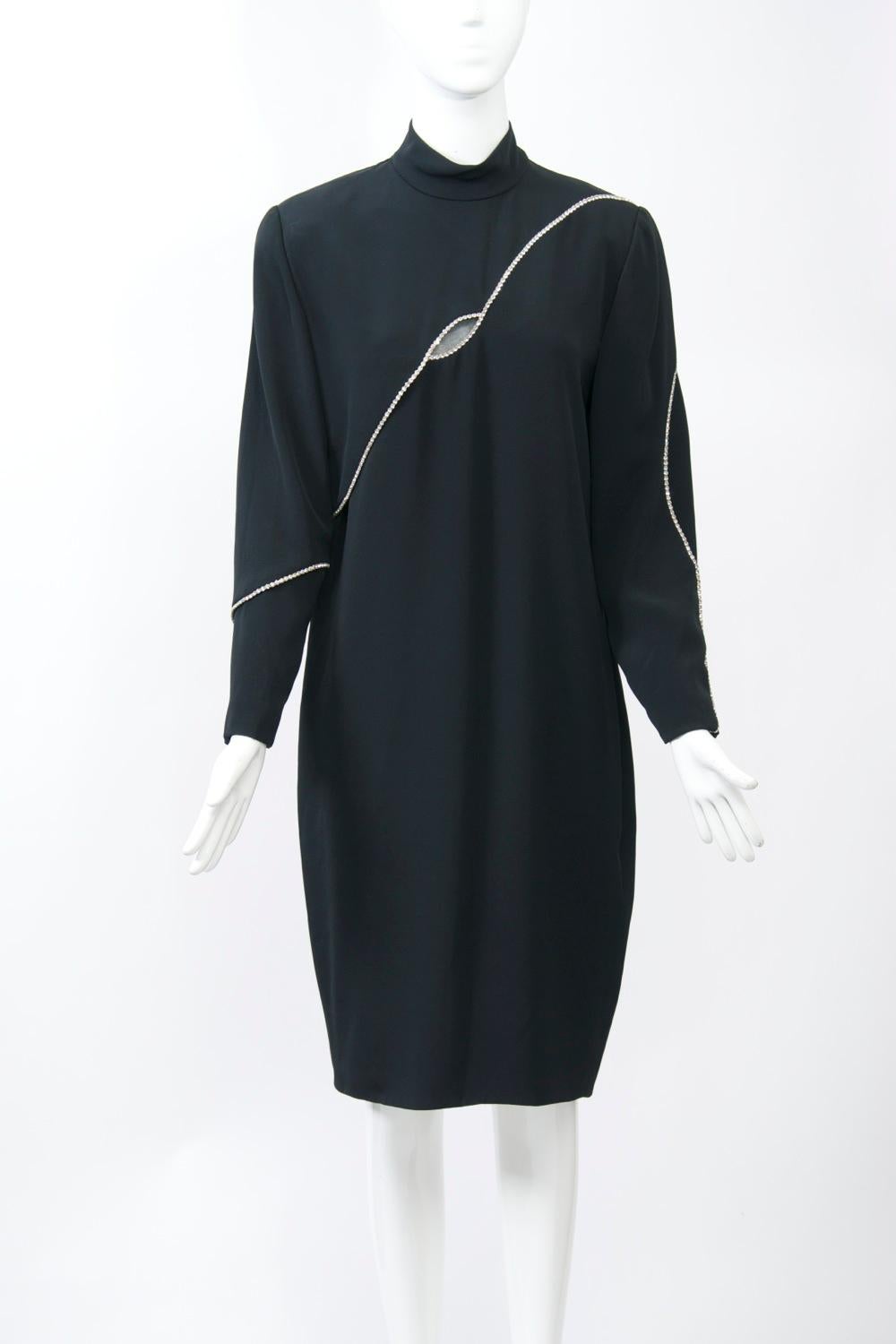 The Boston-area boutique Cyreld, named for its founder Cyreld Spiller, was known for its high quality fashion and famous clientele from the mid 1950s until 1995. This simple black cocktail dress is distinguished by its interesting embellishment -