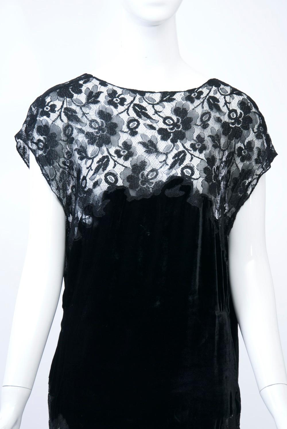 1930s black lace gown and bolero jacket, the long dress having an open neckline and cap sleeves and featuring a deep panel of black silk velvet extending from the bust through the hips and terminating in a V front and back. The graceful back is a