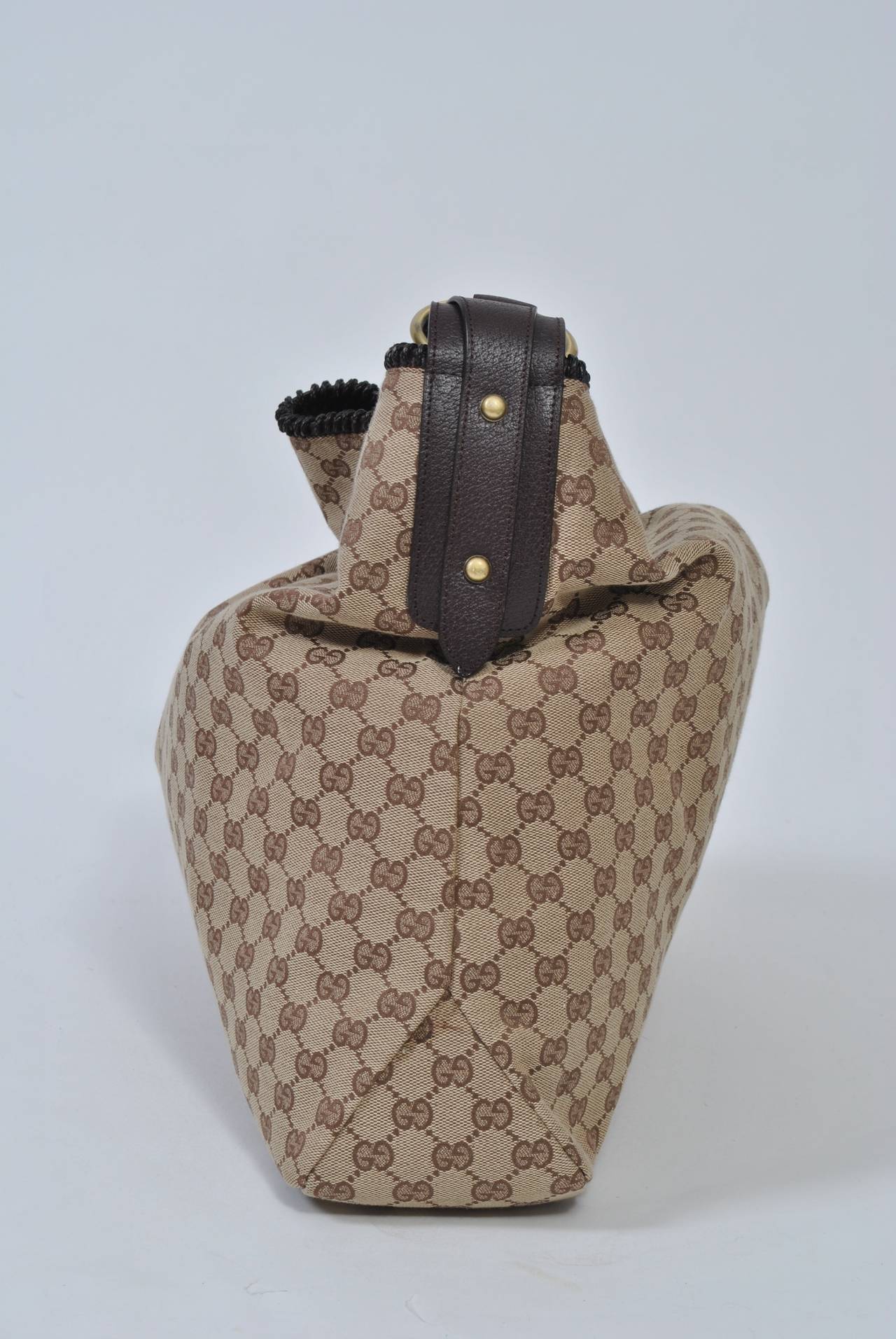 Large Gucci horsebit hobo bag in brown logo fabric with brown leather trim. Excellent condition inside and out.