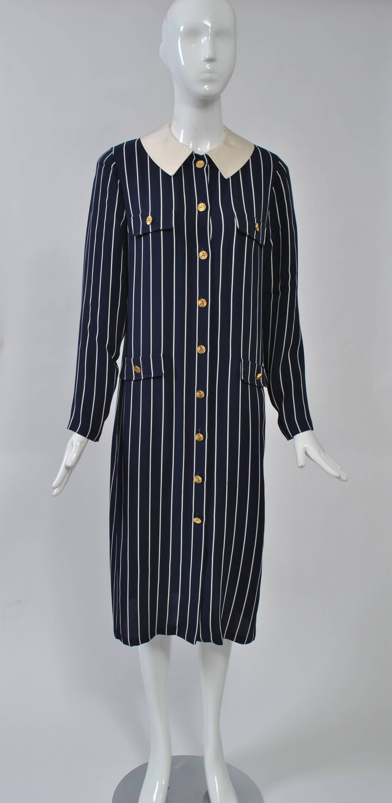 Adolfo 1980s navy/white pinstripe shirtdress in lightweight fabric - silk or silk blend. Buttons all the way down the front with gold 