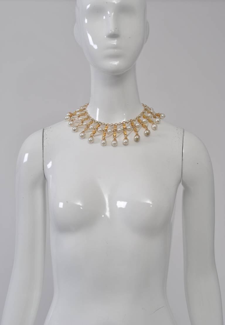 Nice Vendome bib necklace composed of goldtone elements and pearls. Adjustable pearl chain closure. Signed. Looks great on bare skin or high neckline.