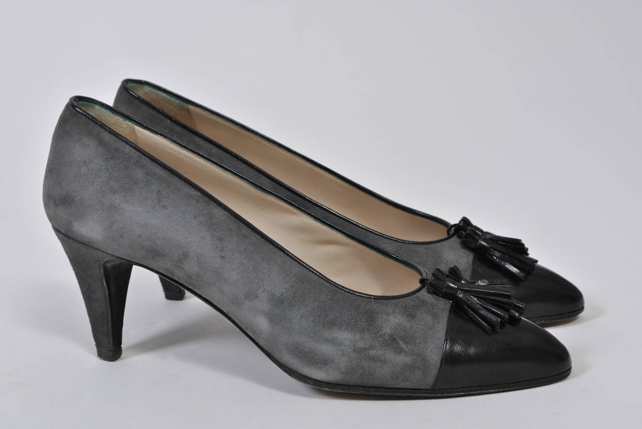 Chanel gray suede pumps with black leather toe caps and tassel. Hardly worn.