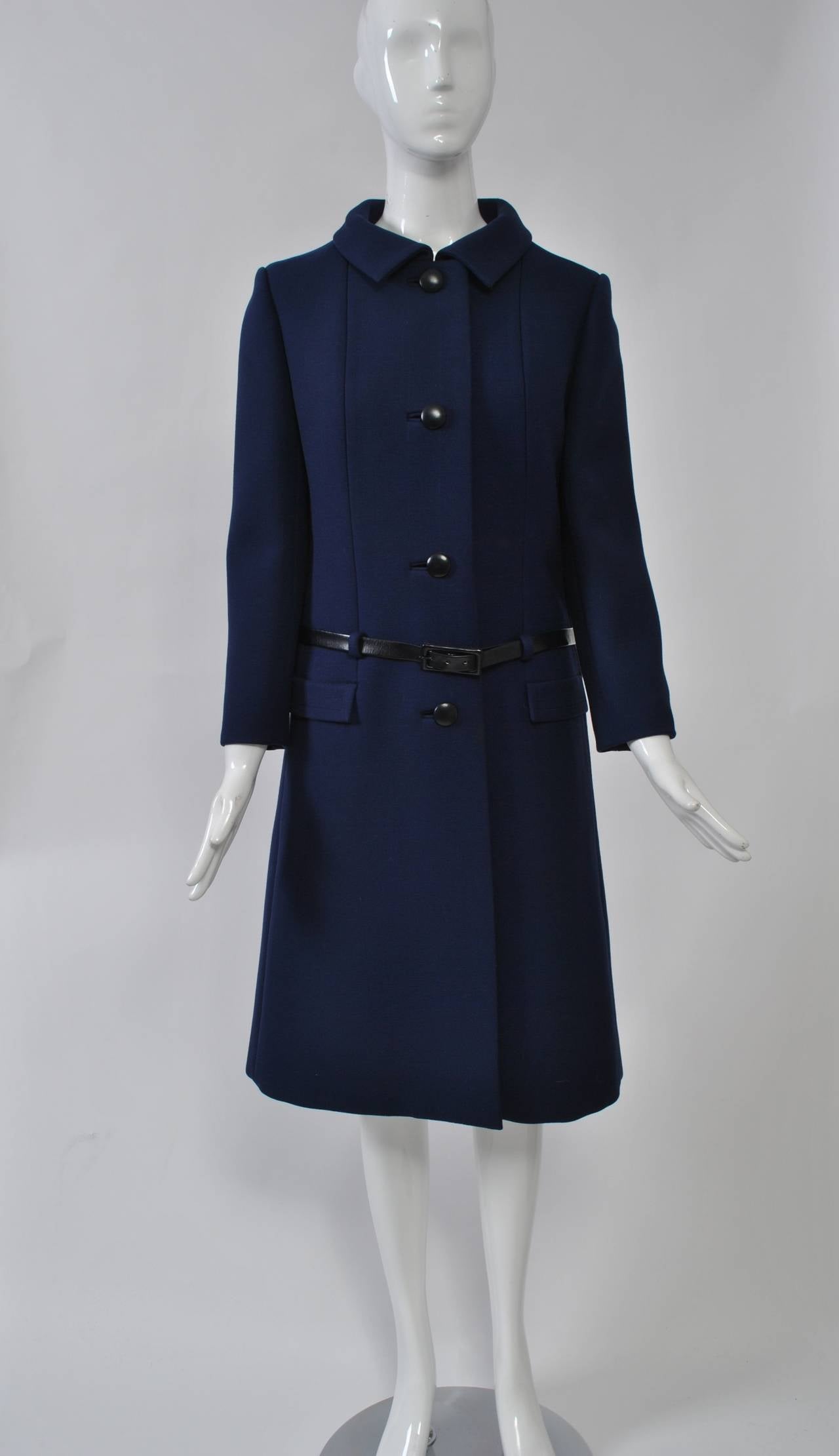 Originala produced some of the most fashionable coats and suits in the 1960s and '70s. From 1964-72, Ilie Wacs was head designer. This ensemble, comprised of a navy coat and white dress, is typical of their cutting-edge style and high-end