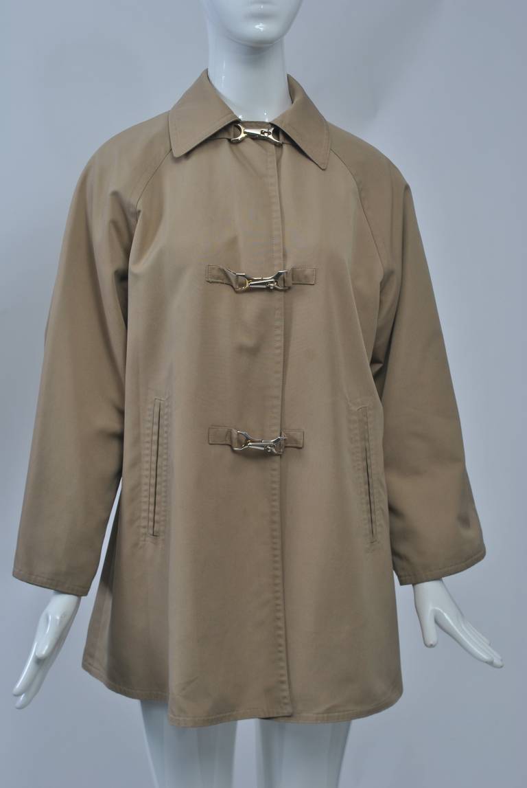 Cotton poplin rain jacket by Bonnie Cashin for the outerwear firm Russell Taylor, for whom she designed 1978-85. The A-line jacket has two distinctive features for which Cashin was known - toggle closures (these are among the best we've seen) and