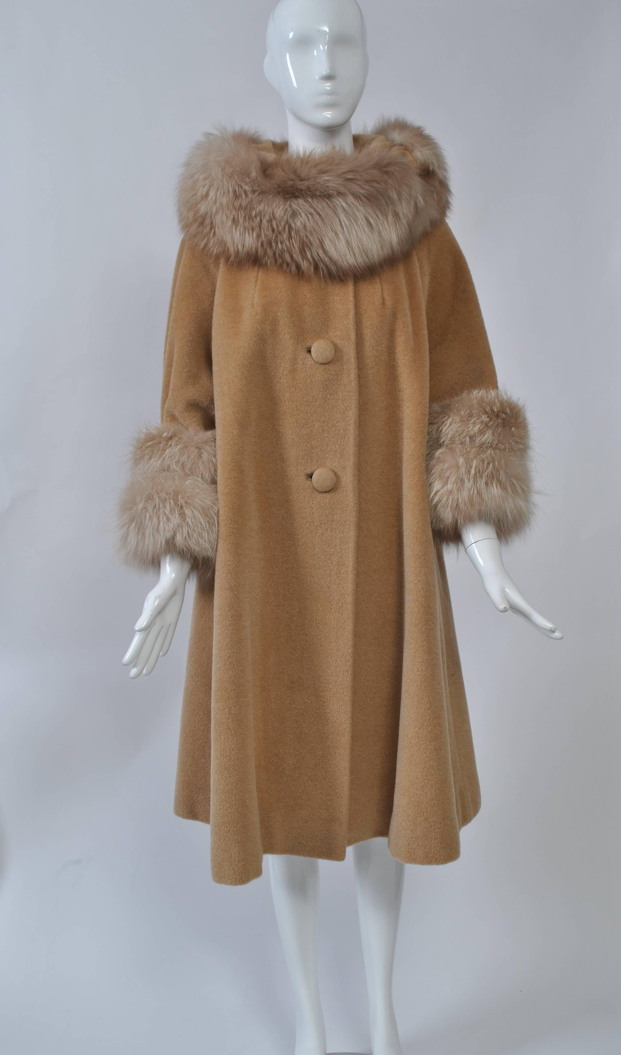 Lilli Ann produced some of the best and most sought-after coats and suits in mid-century America, most influenced by Hollywood drama. This coat is exemplary of the company's flair for drama and its use of luxurious fabrics, most imported from