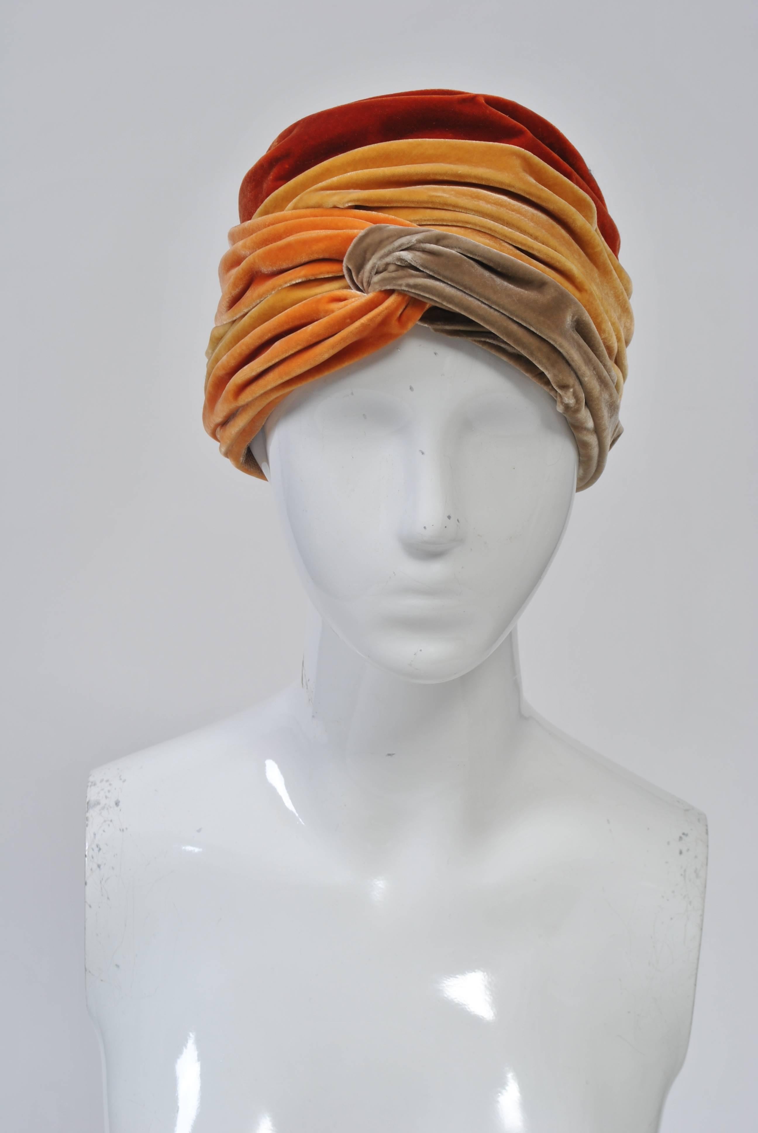 Velvet turban in orange, marigold, and taupe, c. 1960s, with net lining. Looks unworn. Made for Lord & Taylor. Size S-M.