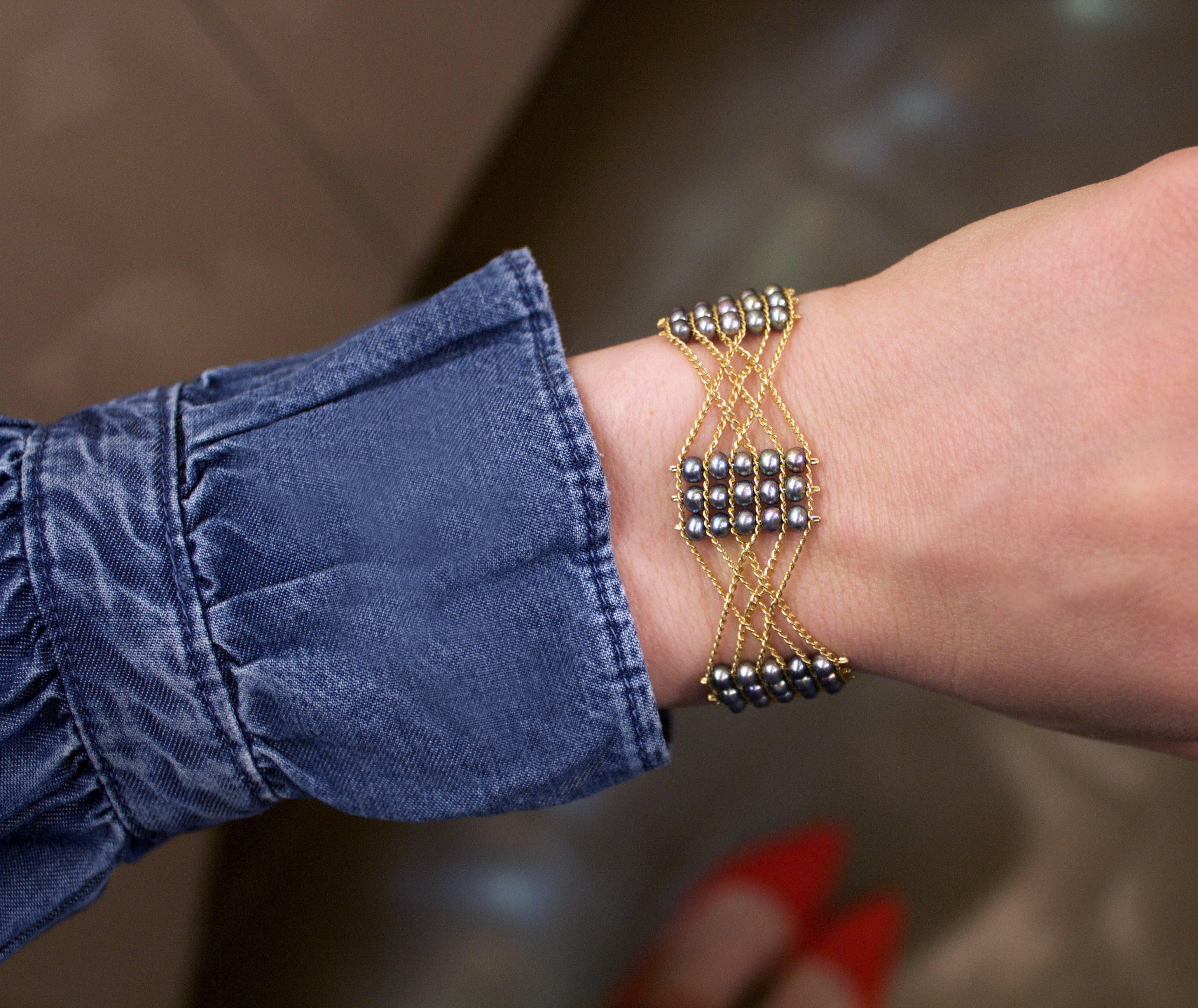 Blue Pearl Celtic Knot Bracelet handmade by jewelry artist Estyn Hulbert on a gold-filled chain with a 14k clasp.