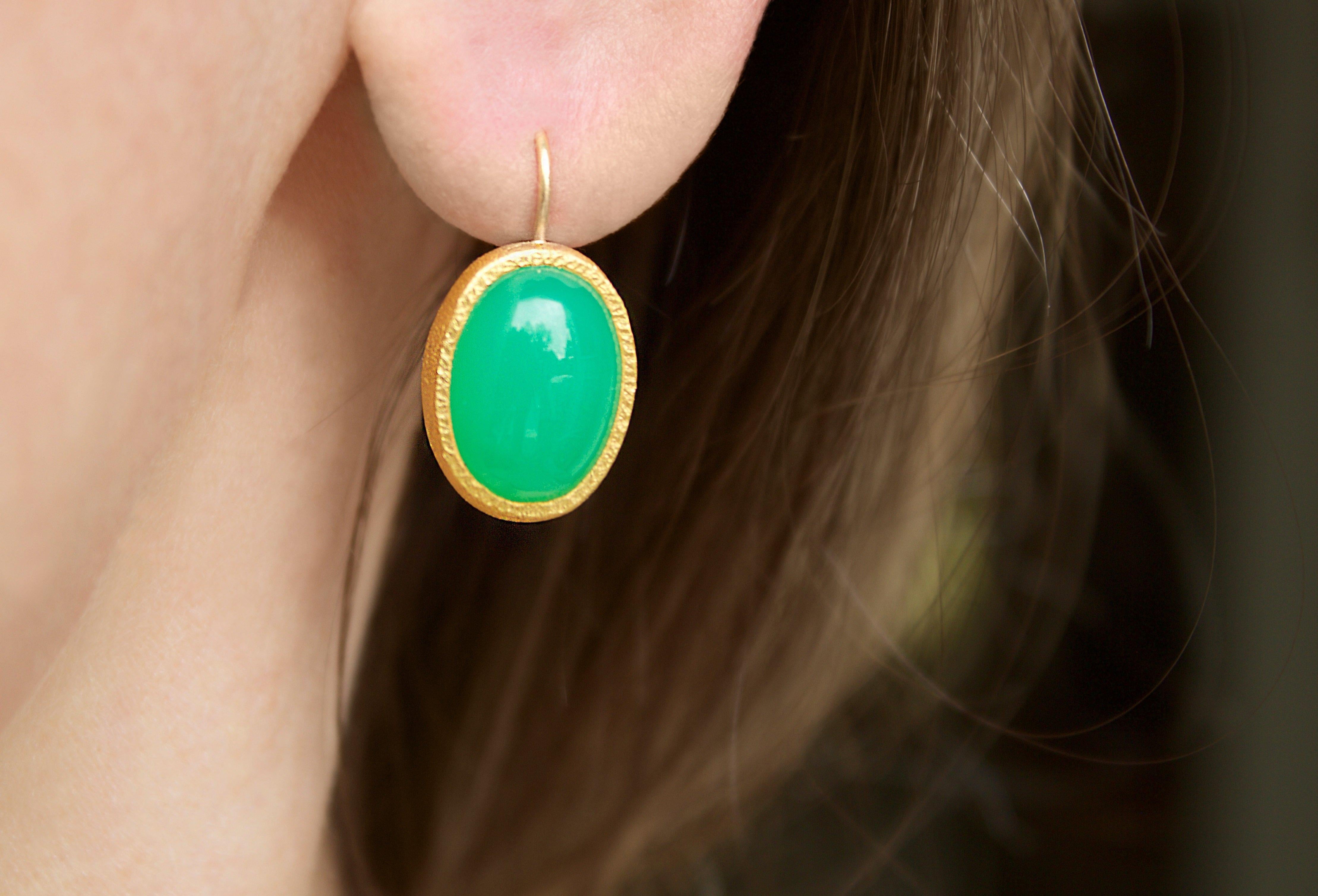 Dangle Drop Earrings handcrafted by jewelry artist Devta Doolan in signature-finished 22k yellow gold finish featuring a matched pair of vibrant green cabochon-cut chrysoprase. Stamped and Hallmarked 22k with a designer signature. 