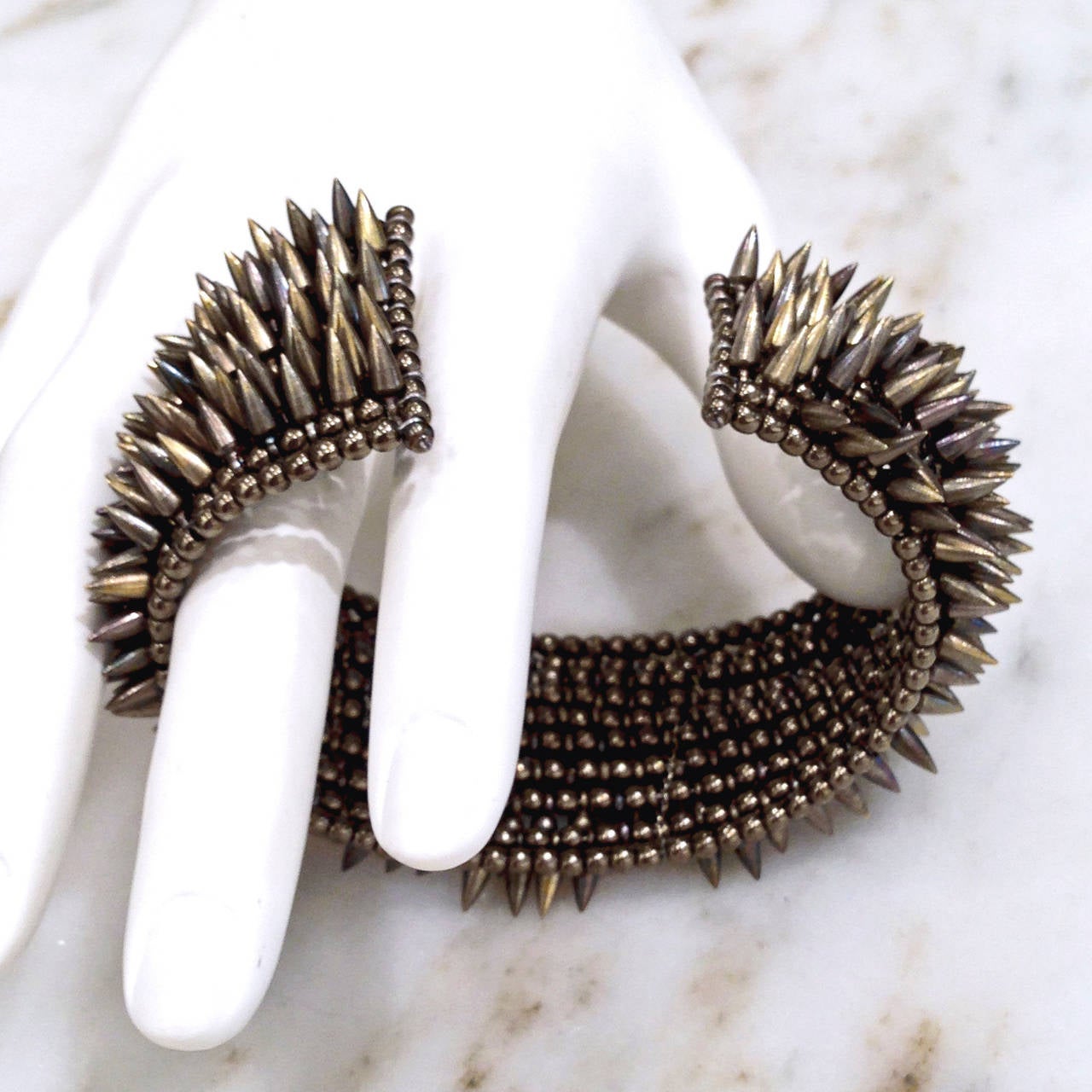 Intricate Eight Row Multi-Finished Bullet Bronze Bead Flexible Cuff In New Condition In Dallas, TX