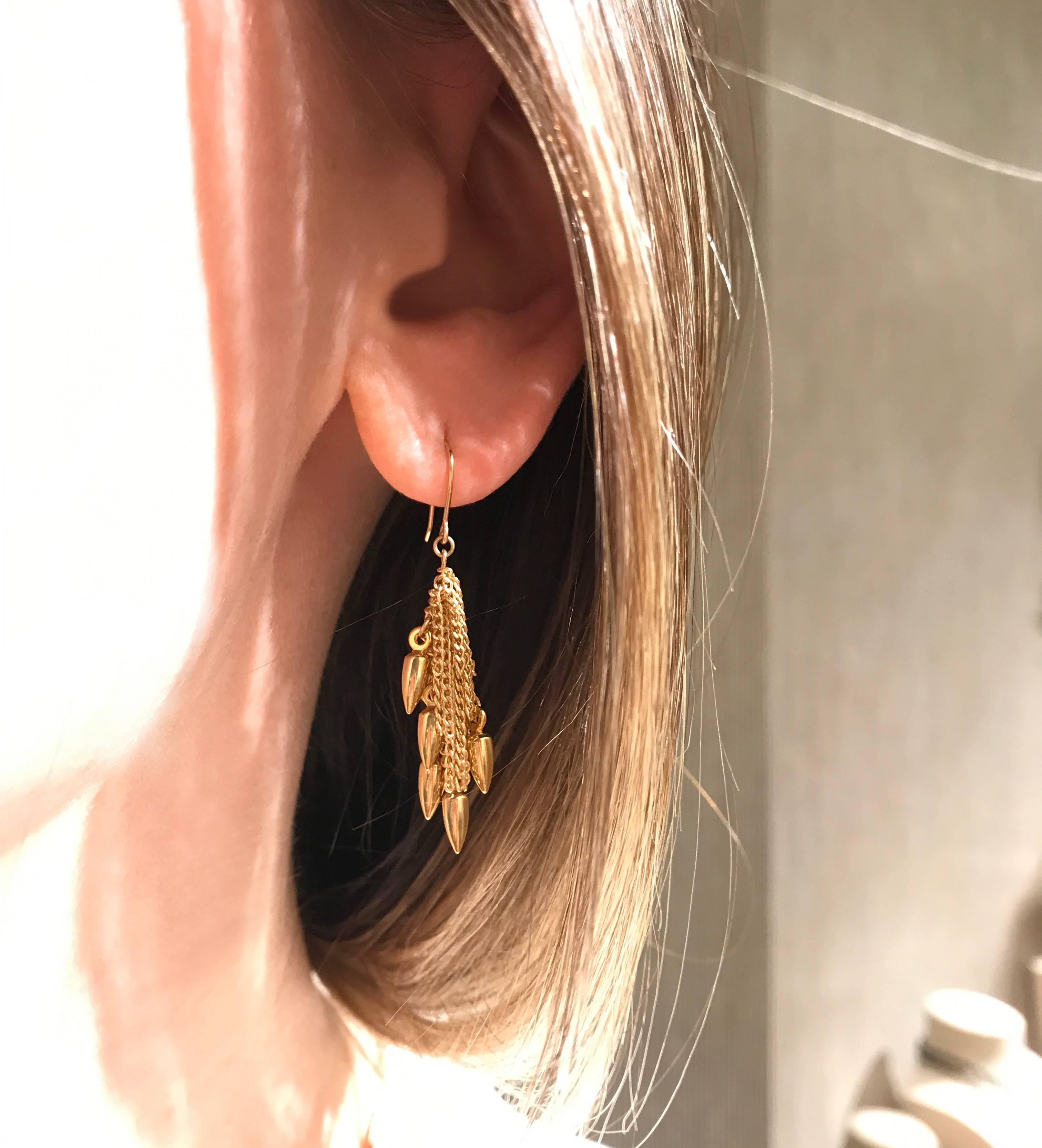 Bullet Cluster Earrings handmade by jewelry artist Estyn Hulbert with shiny gold-plated bullet beads, gold-filled chain, and 14k yellow gold ear wires.