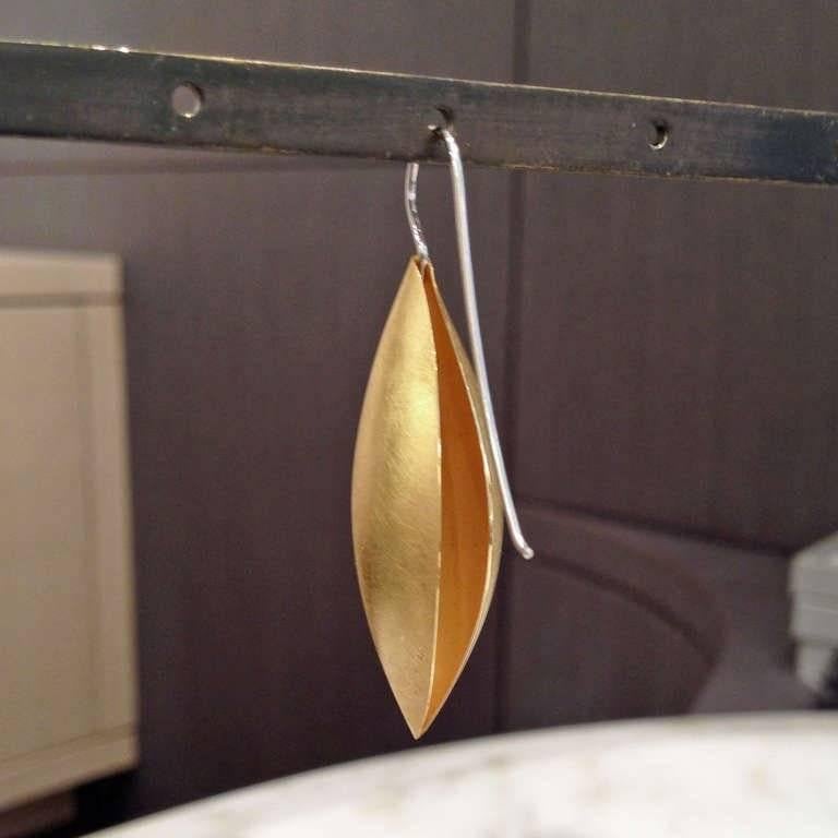 Medium Cocoon Earrings handcrafted in Germany by acclaimed master metalsmith and jewelry designer Erich Zimmermann in 18k yellow gold with a brushed finish on platinum ear wires, 40mm. Open back and hollow core allow for a light earring with