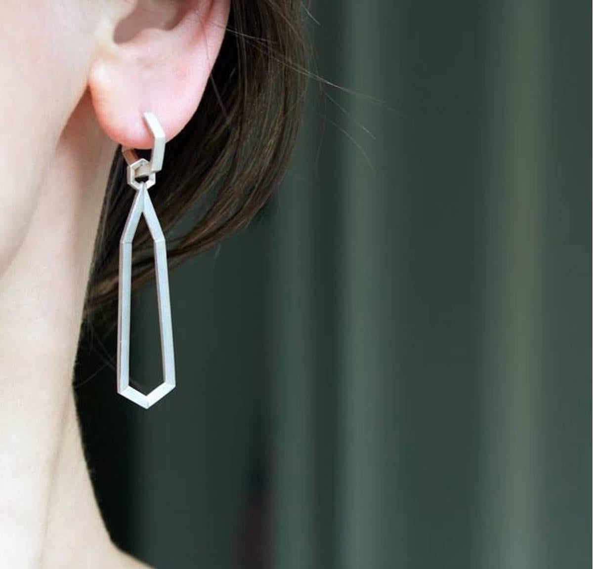 Two Earrings in one! Hex Day and Night Earrings handcrafted by renowned jewelry designer Geoffrey Good in satin-finished sterling silver showcasing a pair of detachable, elongated hexagonal drop elements attached by a hex-shaped jump-ring to a pair