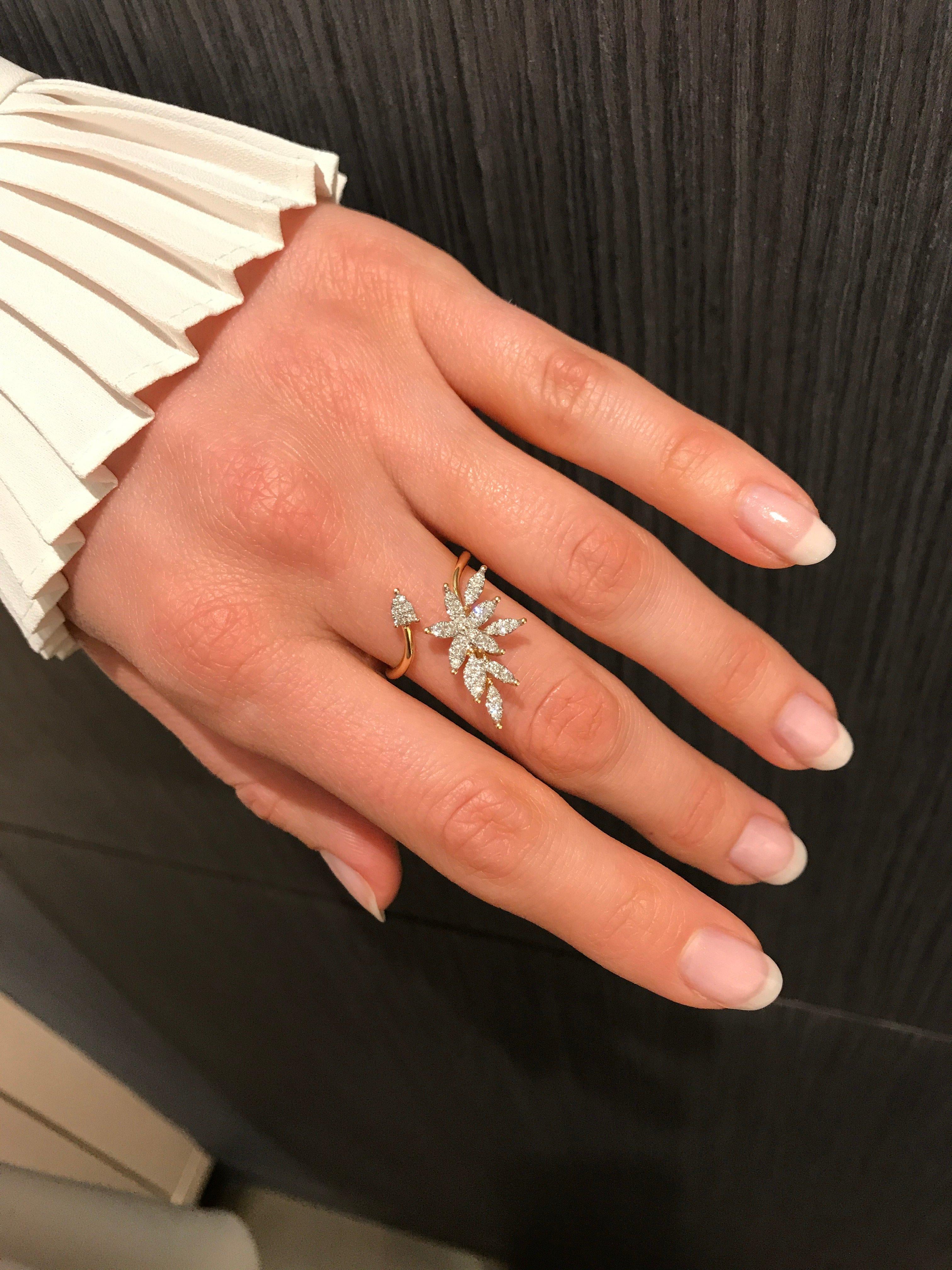 Open Petals Ring handcrafted in 18k yellow gold with marquise petals set with  36 round brilliant-cut white diamonds. Size 7.5 (can be sized).

Stamped 18k / 750 / W22938