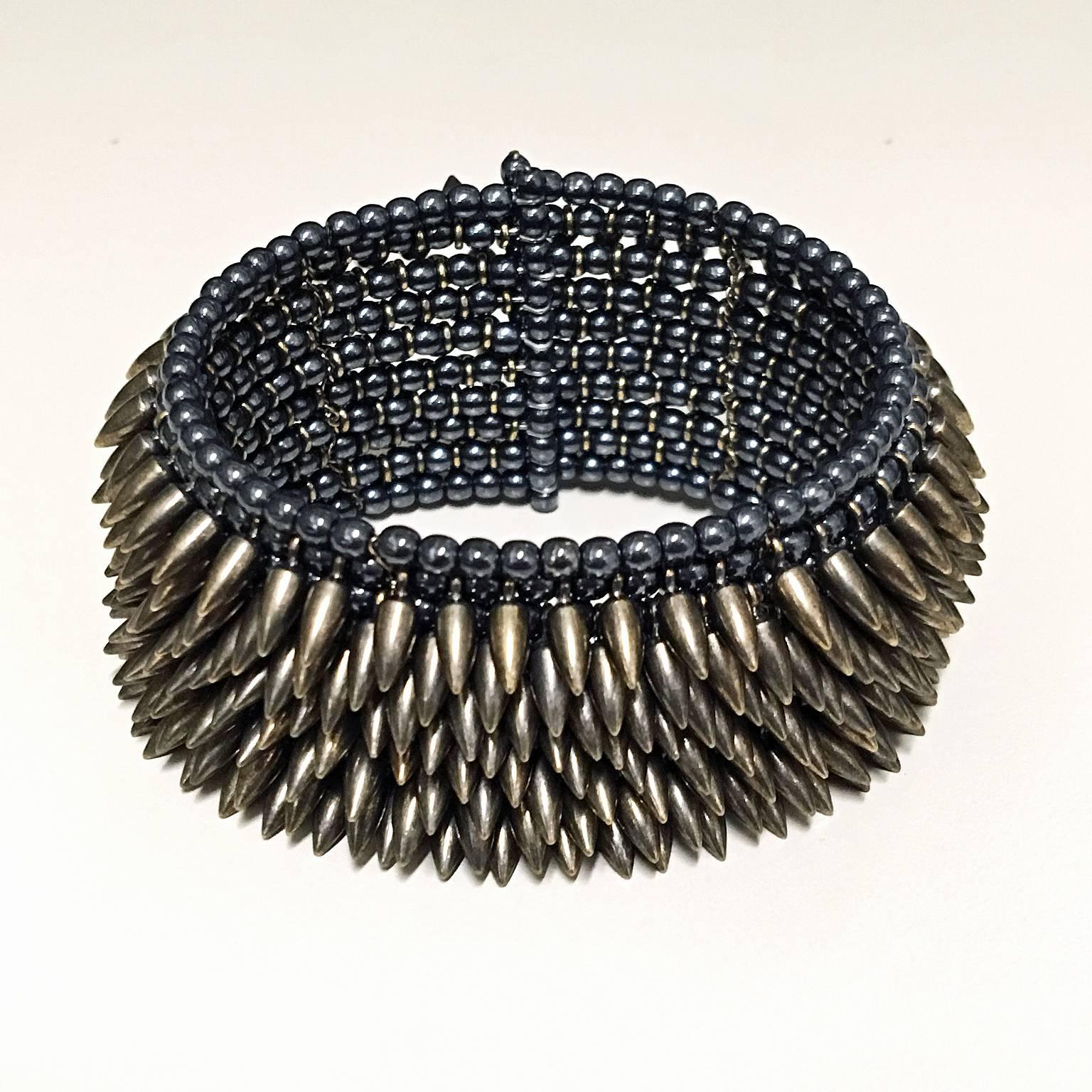 Eight Row Bullet Cuff handcrafted by Estyn Hulbert with steel bullets and hematite beads on dark-toned chain. Stretchable, flexible and comfortable! 
