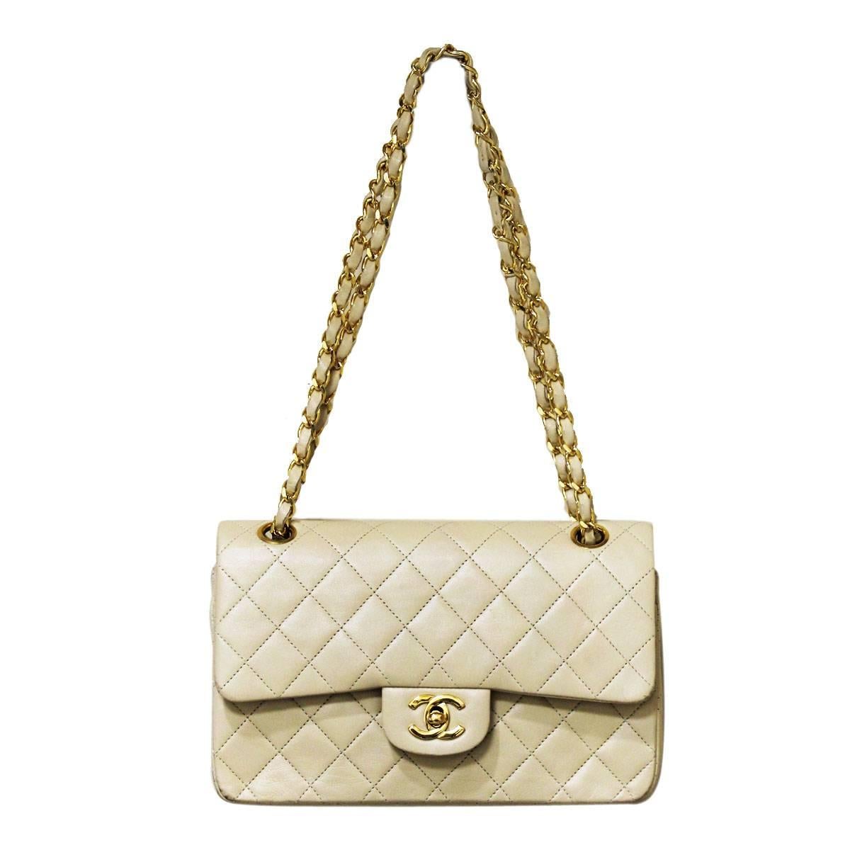 Company: CHANEL
Style: Shoulder Bag
Handles: Beige Lambskin Leather Braided with Gold Tone Chain
Measurements: 5.5