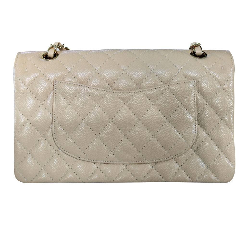 Company: CHANEL
Style: Medium Double Flap Bag
Handles: Beige Caviar Lambskin Braided in Gold Chain Hardware
Measurements: 10