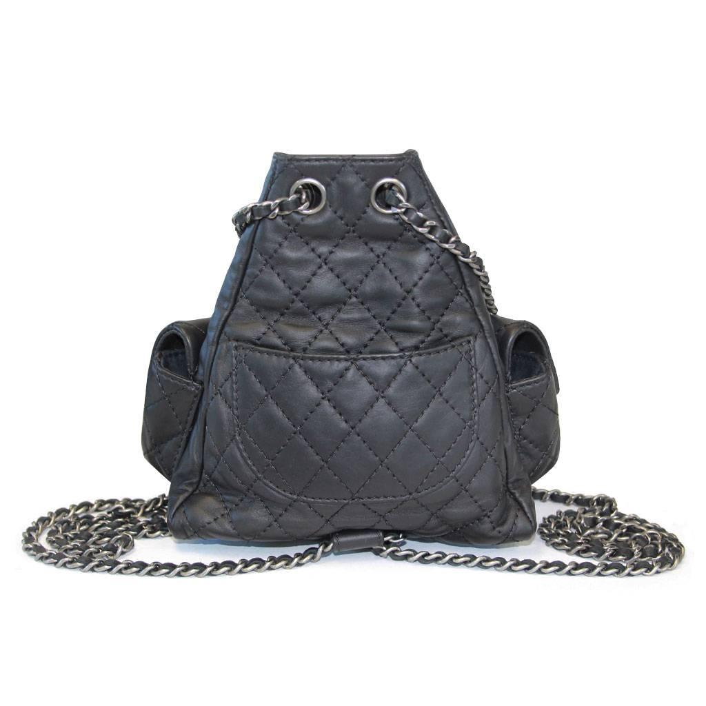 Brand: CHANEL
Style: Mini Backpack
Handles: Interlaced Silver Tone Chain with Black Leather
Measurements: 6.75