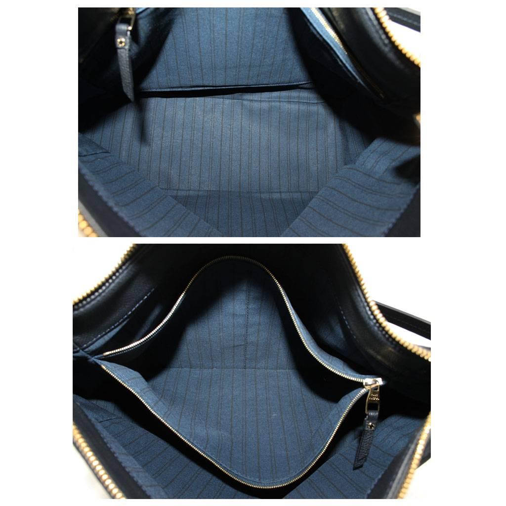 Louis Vuitton Audacieuse Navy Blue Suede Empreinte Leather Handbag In Excellent Condition In Boca Raton, FL
