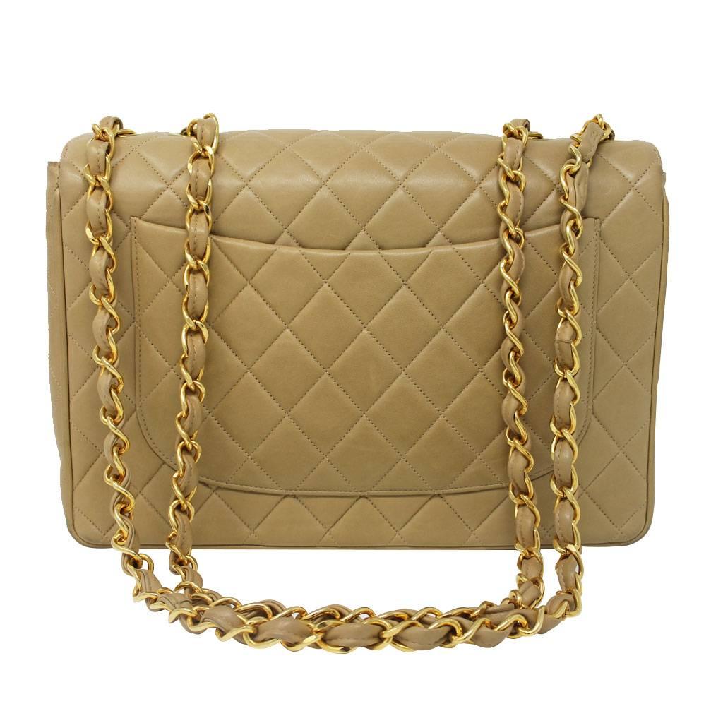 Brand: Chanel
Handles: Beige Lambskin and Gold Chain Shoulder Strap
Single Strap Drop: 13.5" Double Strap Drop: 25.5"
Measurements: 12.25" x 3" x 7.5"
Materials: Beige/Tan Lambskin, Golden Brass Hardware
Interior: Beige/Tan