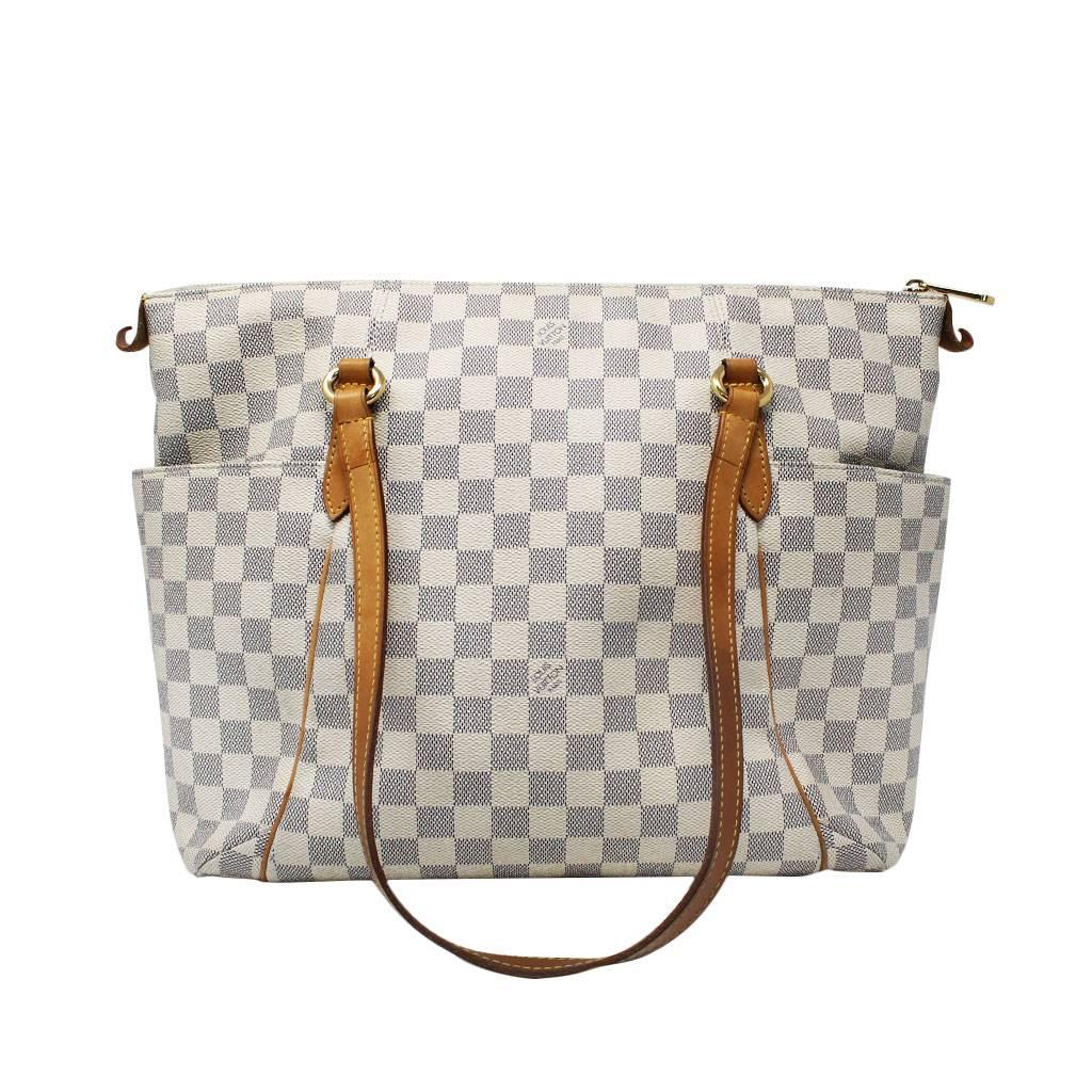 Brand: Louis Vuitton
Handles: Cowhide Leather Shoulder Straps; Drop: 10"
Measurements: 16" x 6" x 11.5"
Materials: Damier Azur Canvas
Cowhide Leather Trim
Golden Brass Hardware
Interior: Beige Canvas Lining
1 Large Pocket, 1