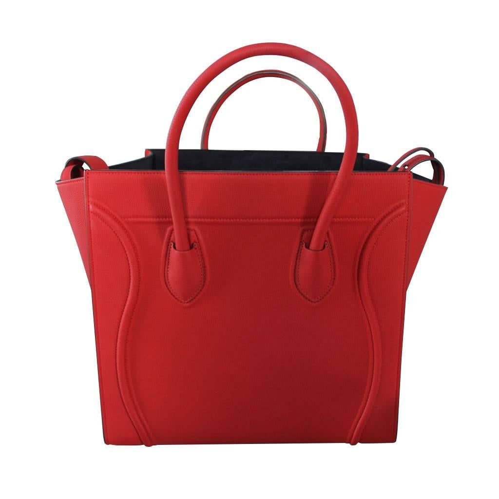 Company: Celine
Style: Luggage Tote
Handles: Rolled Red Leather Handles; Drop: 4 inches
Measurements: 11