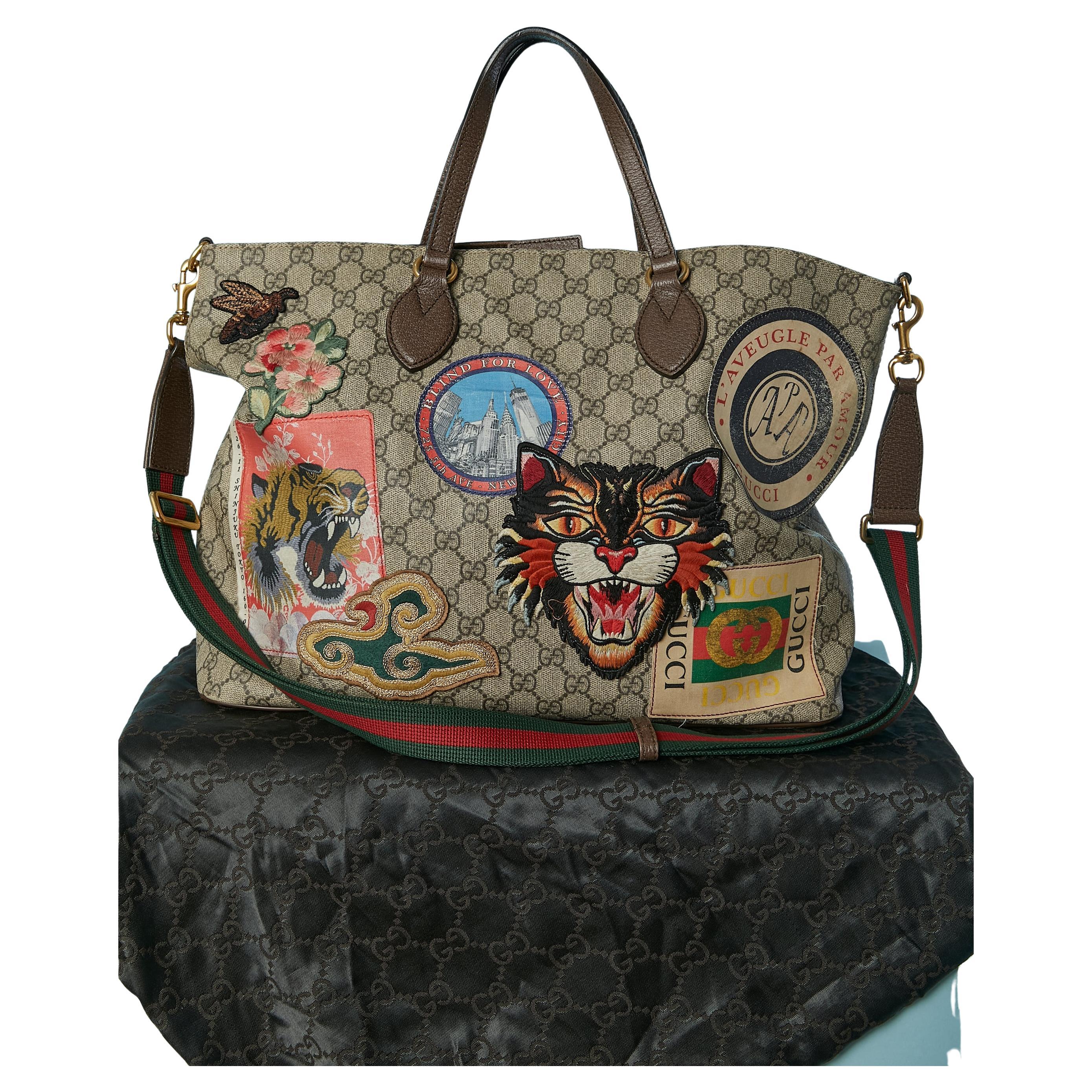Borsa Supreme GG coated canevas con manico superiore e toppe Gucci