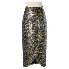 Black leather wrap dress with gold print CHANEL Métiers d'Art Egyptomania 2018