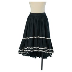 Black asymmetrical coton flair skirt with white ribbon appliqué ESCADA
