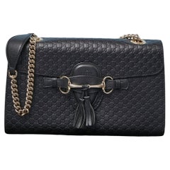 Black leather shoulder bag with monogram GUCCI