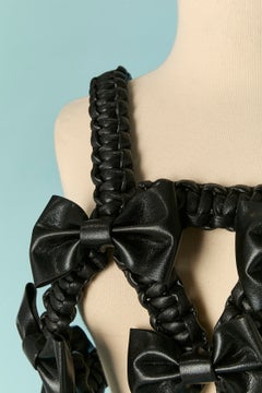 Black Faux leather backless top NOIR by KEI NINOMIYA & COMME DES GARCONS