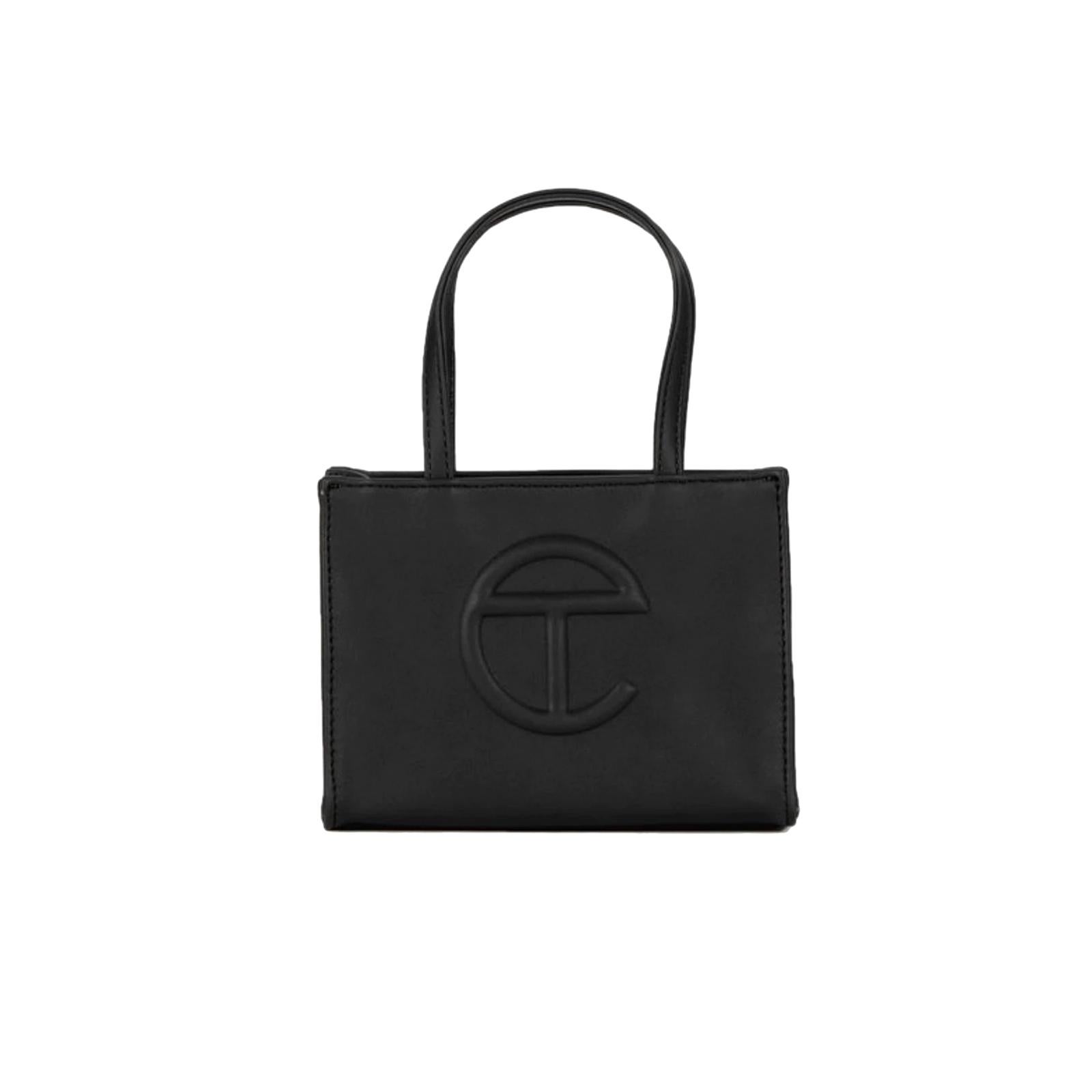 This bag is made with with vegan/faux leather and twill interior lining. Featuring a double strap (handles and cross-body straps), embossed logo, and magnetic snap closure. The bag is packaged in a 100% cotton drawstring dust bag with screenprinted