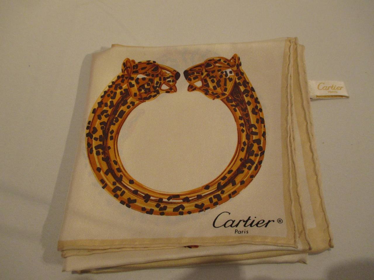 Beautiful 100% silk scarf from the house of Cartier.
sizes 64cm x 65 cm
Please note that vintage items are not new and therefore might have minor imperfections.