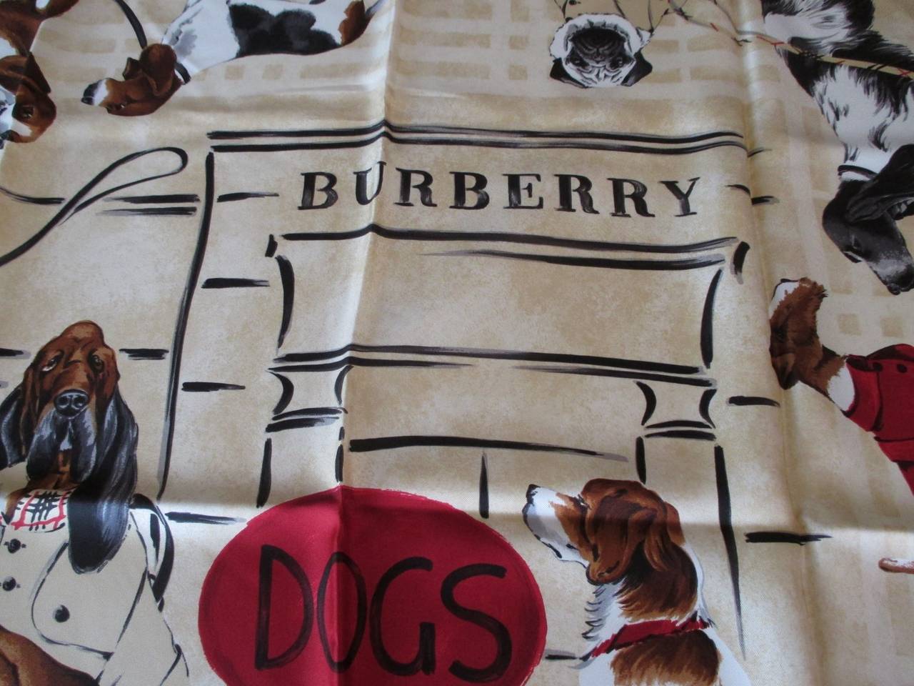 Beautiful large Burberry 100% silk
Authentic Dog Motif Scarf. 
measurements  aprox. 85cm x 86cm
