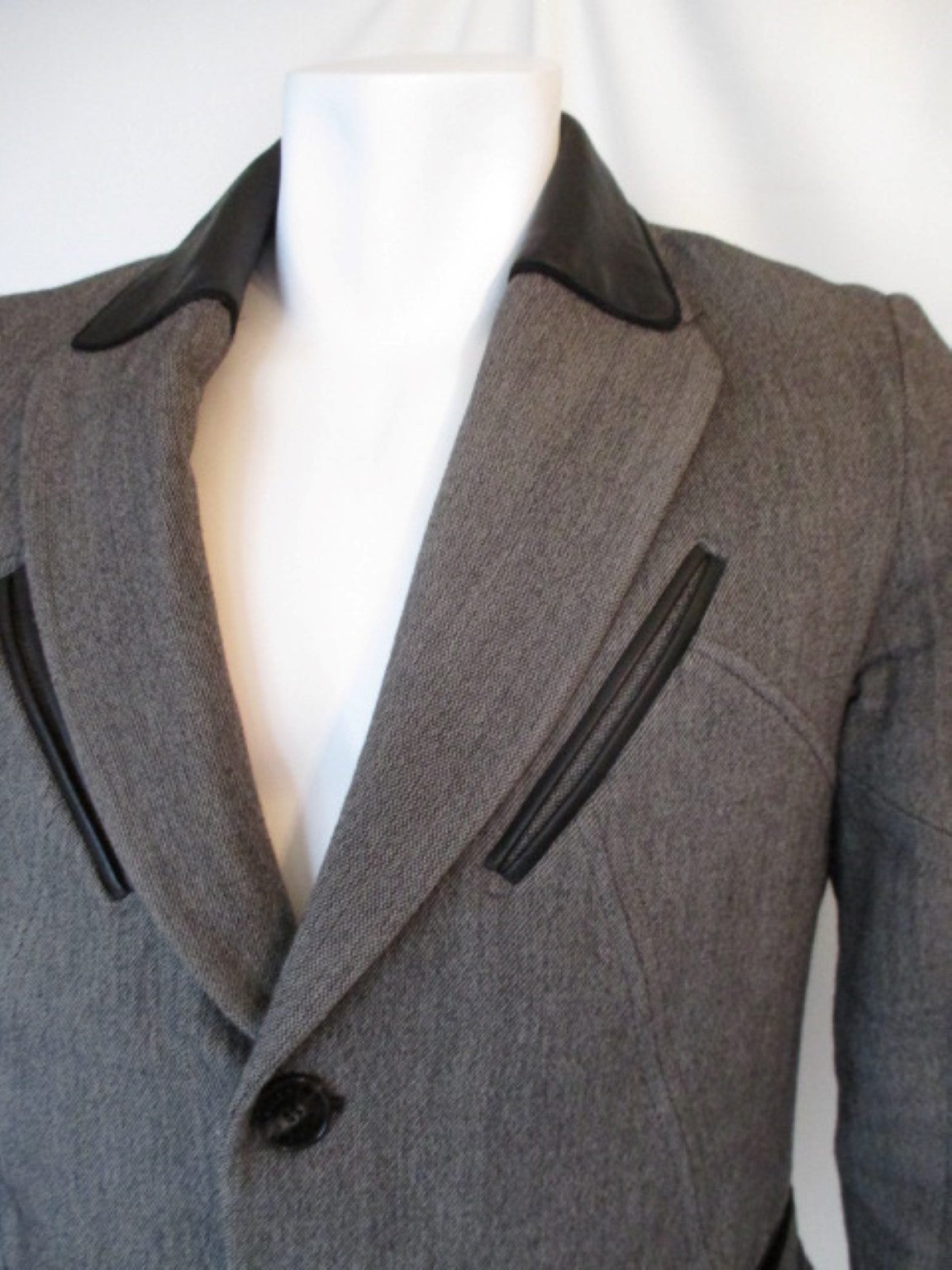 Christian Lacroix men's blended wool, cotton jacket
Color is grey black with black leather trim
and with a black and white patterned lining.
size is GB and US 40  and France 50