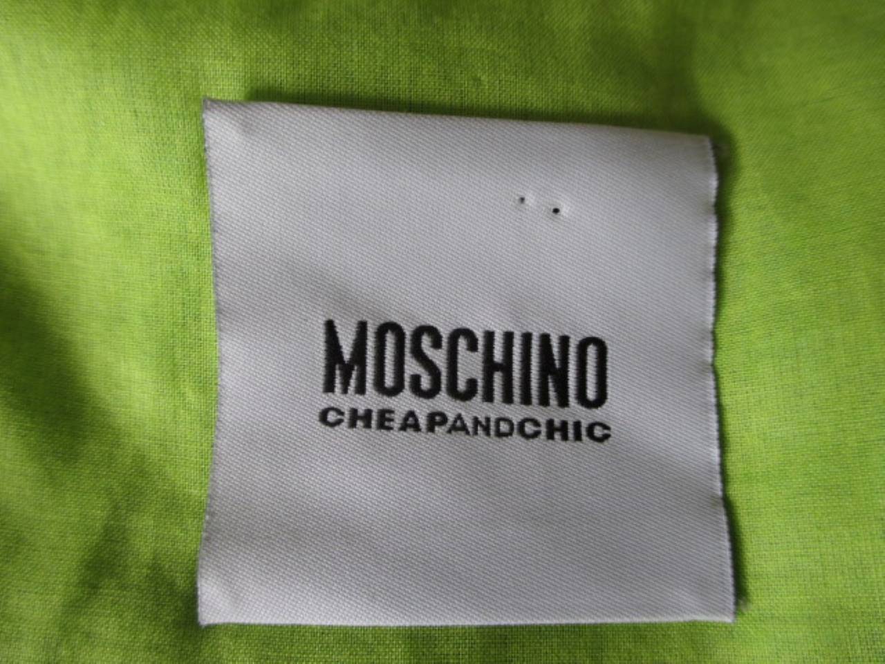 Moschino jacket from the collection Cheap & Chic with purple, lime green and blue stones embroidered.
color jacket green/blue and the lining is lime green
with press buttons closures
Material : cotton
Size: US 12, GB 14, F 42, D 42, I 46

Please