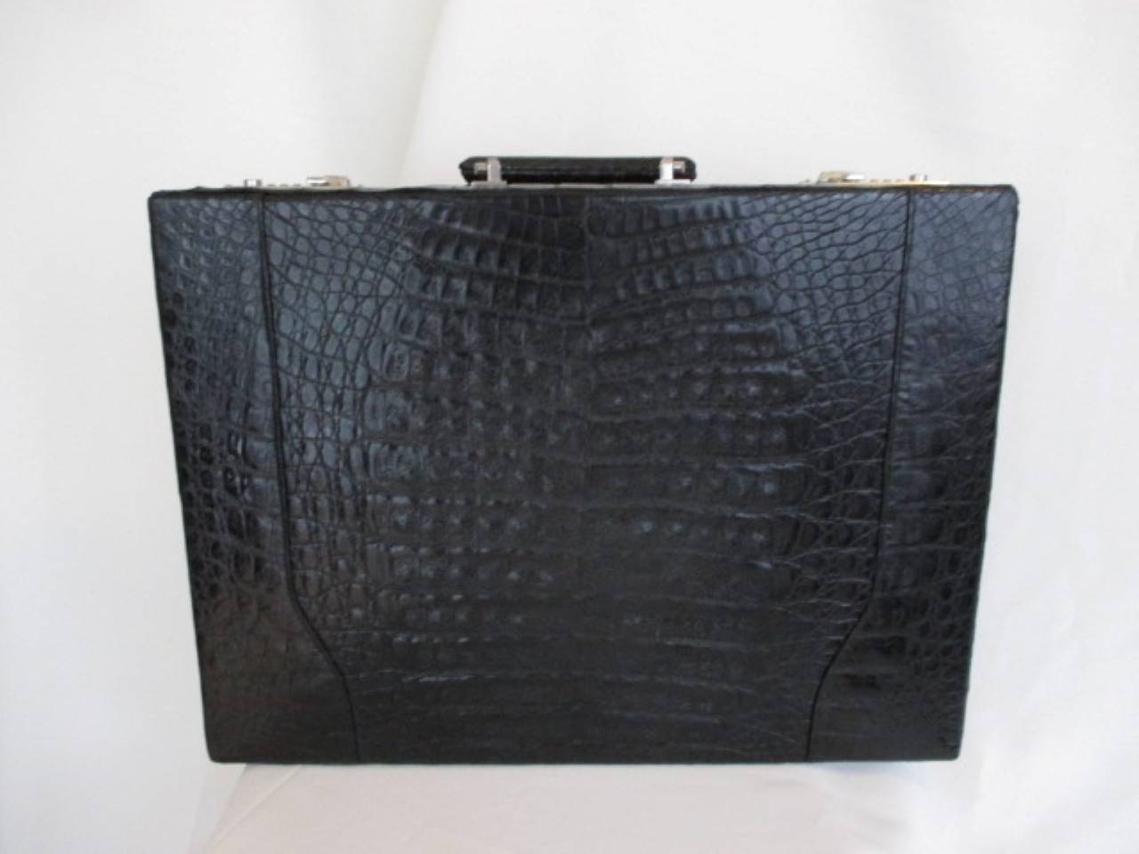 Rare hard-sided attache case made of finest black alligator belly.
Interior is leather with pockets and with hidden combination locks.
Marked:  IRV
Measurements: 46 cm x 34 cm x 10 cm