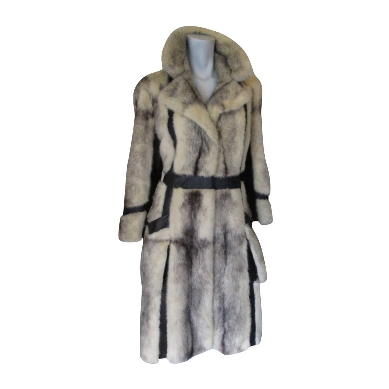 Exclusive cross mink fur knee length coat with leather details