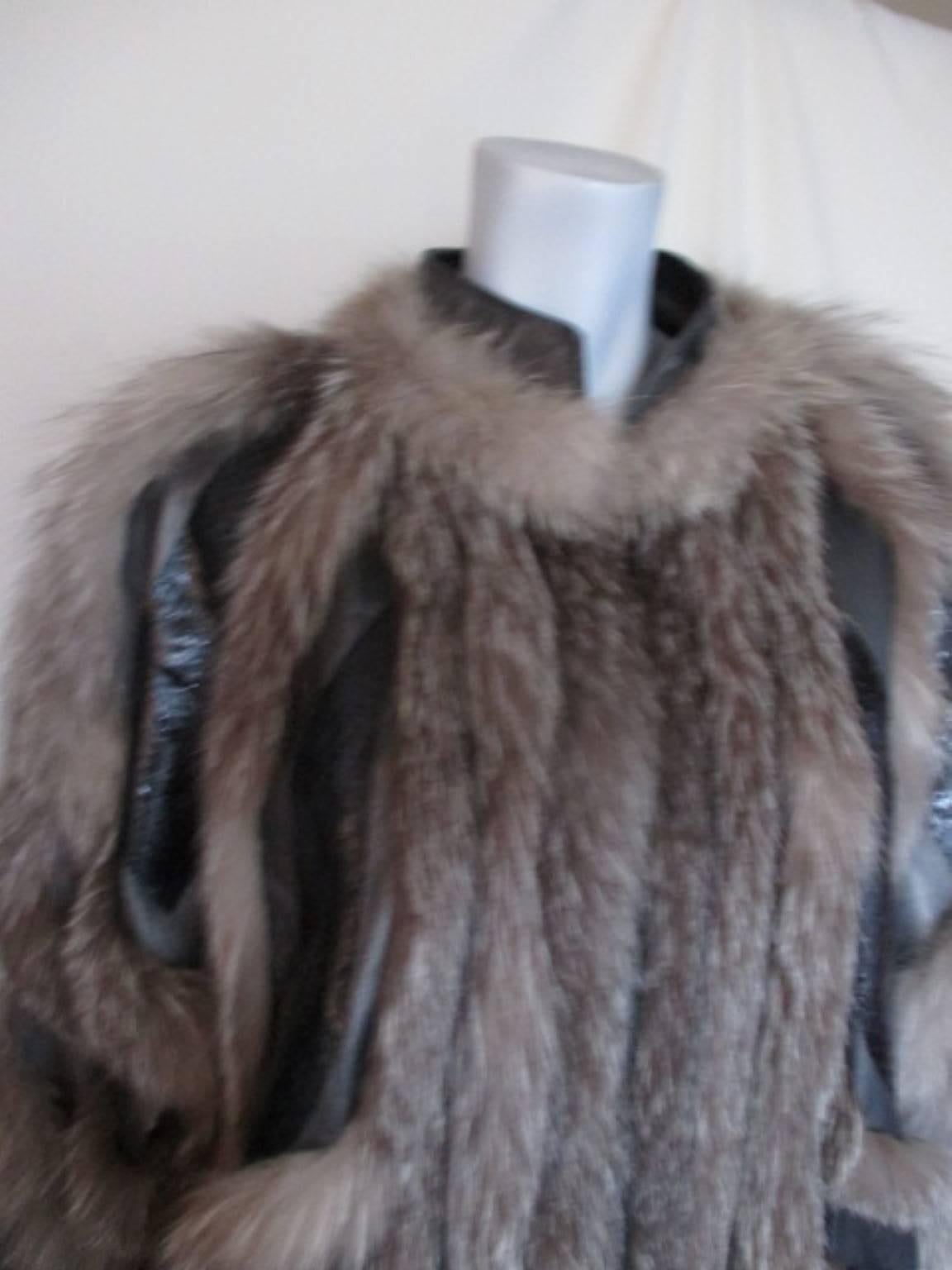 This vintage jacket is very light -weight has 2 pockets, 7 snaps, the jacket has wide sleeves and is made of the soft leather.
The material of the jacket is leather, snake leather details and silver fox fur.
Size fits like a small/medium.
Please