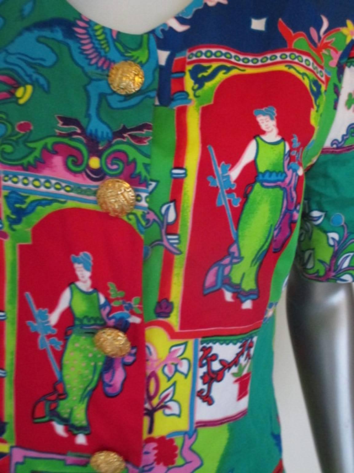 This extraordinarily colorful blazer is short sleeved, with padded shoulders.
The coat has 5 sculpted gold colored buttons with a Greco -Egyptian design.
The size is medium
Please note that vintage items are not new and therefore might have minor