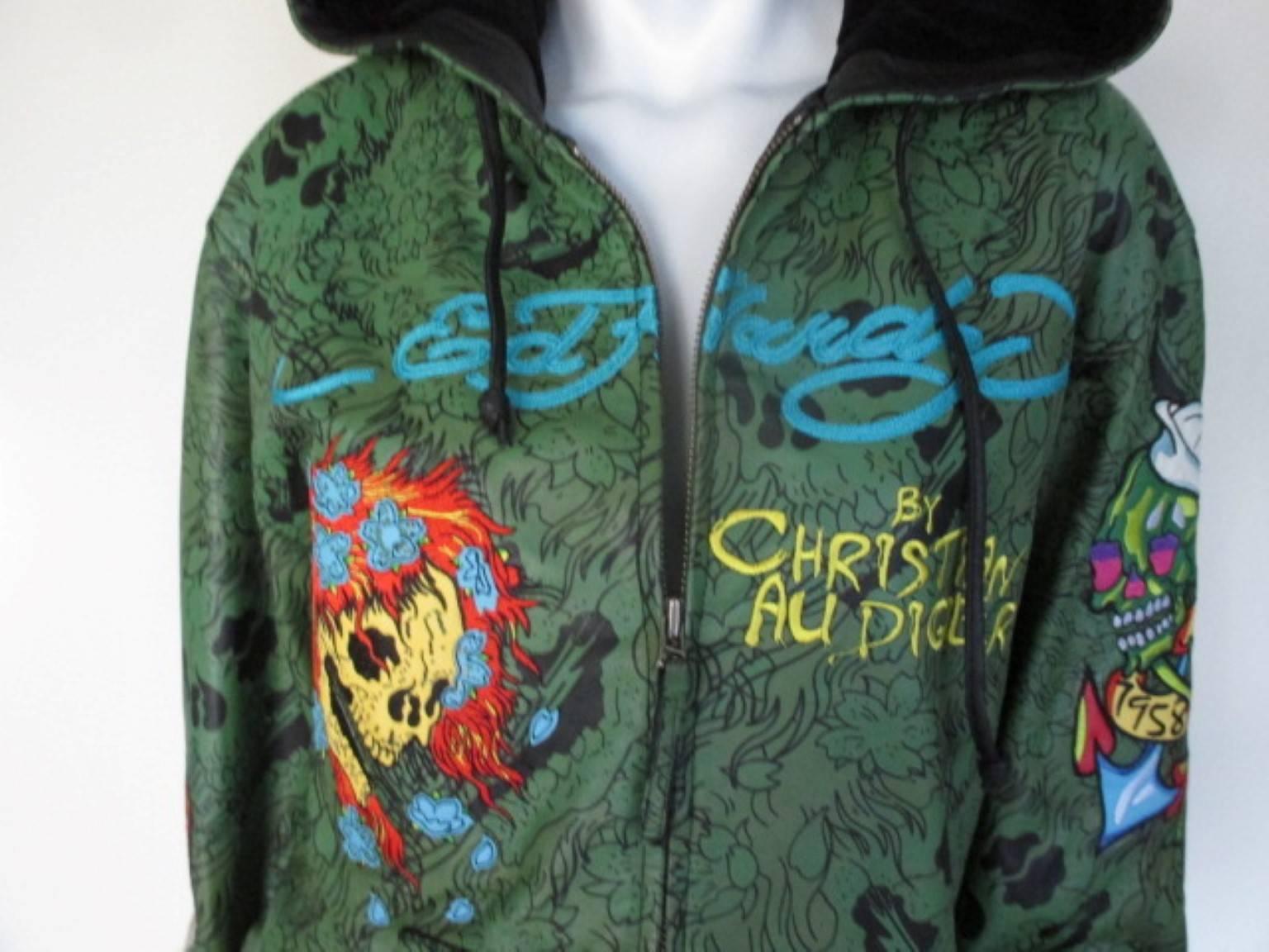 This leather jacket is made by the French designer Christian Audigier who past away in 2015.
He was famous for his rock and roll inspired designs.
The jacket has 2 pockets, a zipper closing and black velvet lining.
It can be worn by man or woman