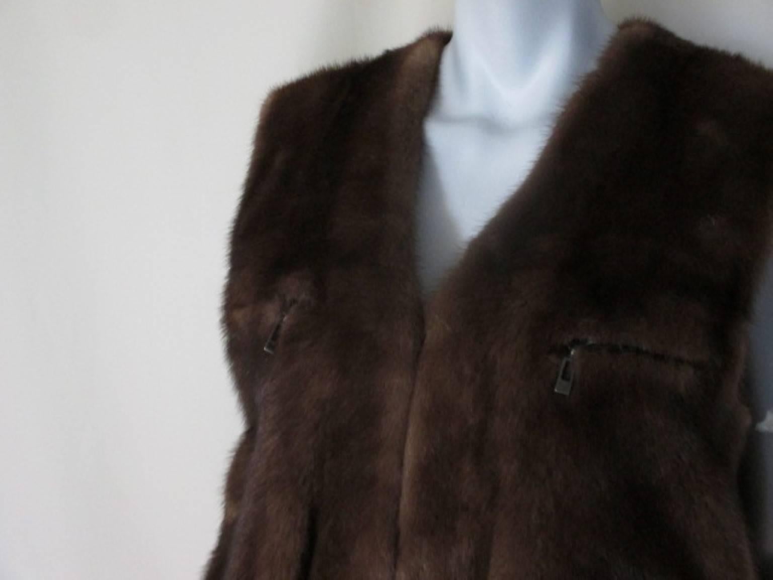 This vest is made of very soft mink fur, has 2 side pocket and 2 zipper pockets.

We offer more exclusive mink items, view our frontstore

Details:
It has belt loops where you can put a leather belt or silk scarf.
Its in very good vintage