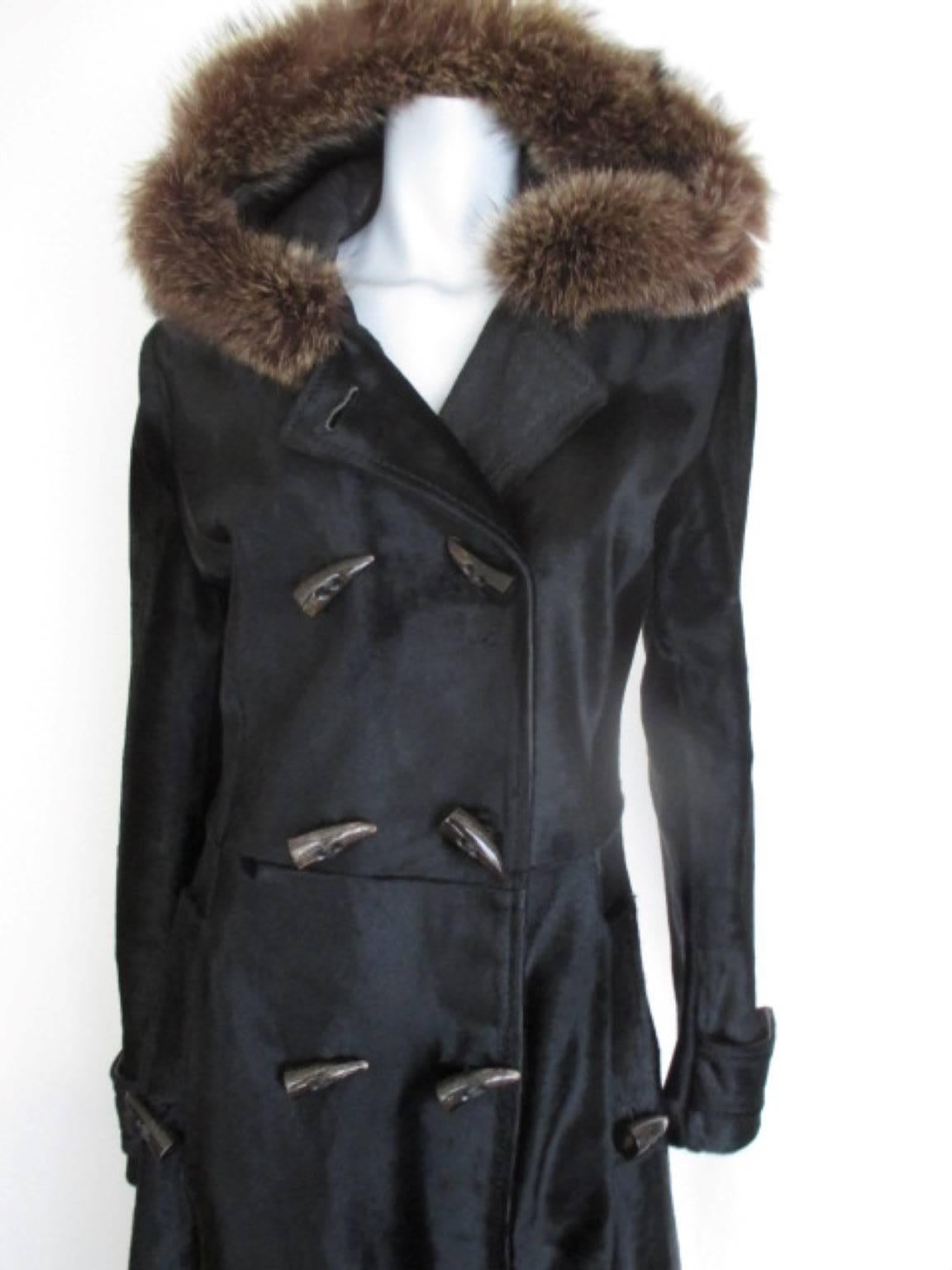 This coat is made of quality skin with a hood lined with soft calf skin leather and fur.

View our frontstore for more exclusive fur items

Details:
It has 2 pockets and double brested with 8 buttons at front, 2 at the pockets and 2 at the