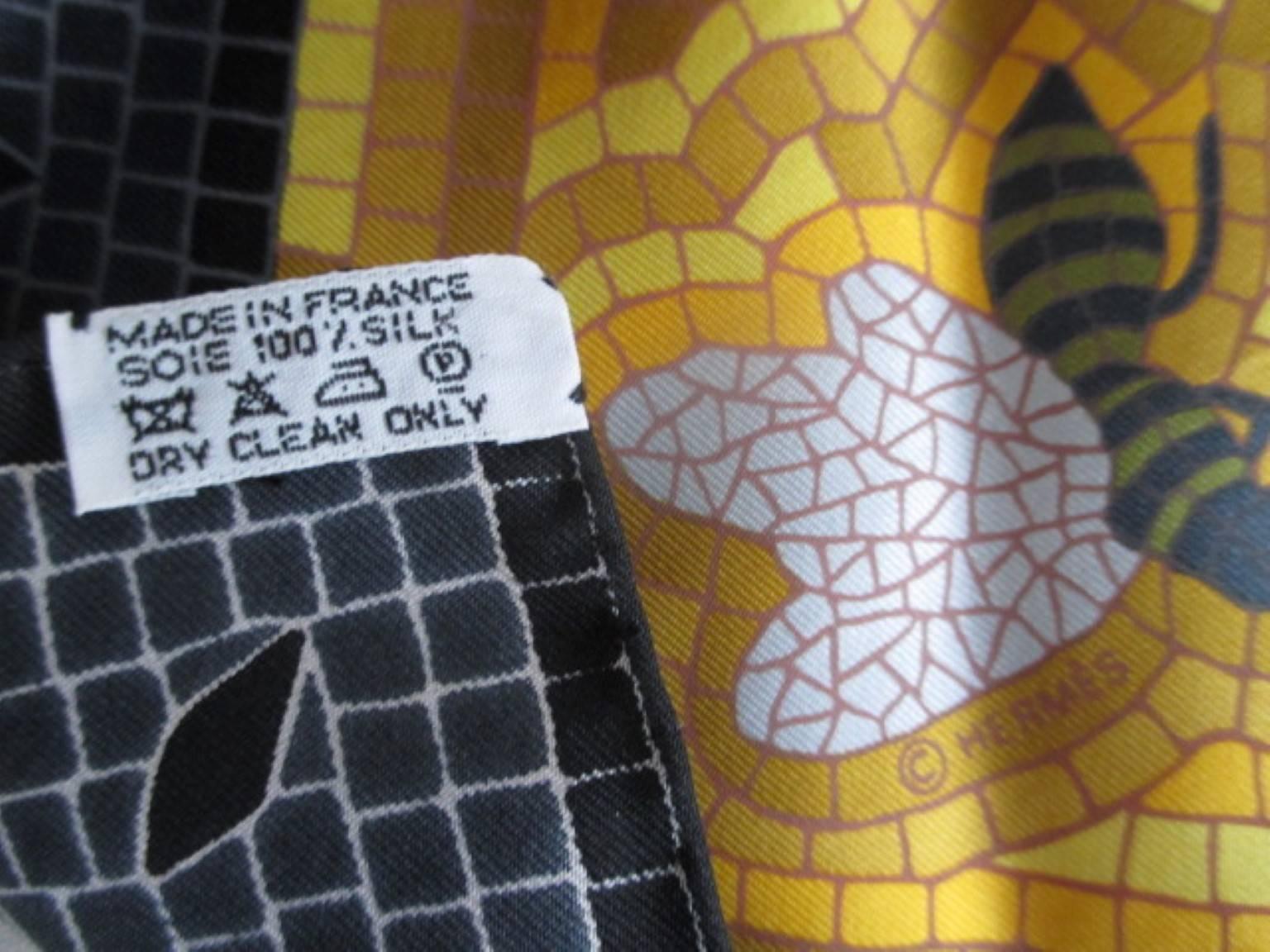 This Hermes Christine Henry design is beloved by cat lovers everywhere.
Made circa 1998.
The mosaic pattern ties wonderfully, and it can be folded so as to show off the tiny creatures hiding in the corners of the scarf, or the cat himself.

This