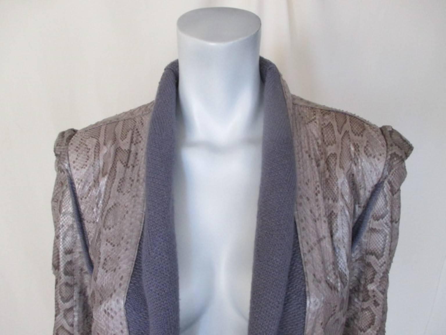 Fabulous original 70s knit coat with old snakeskin appliqués made in Ibiza. designer Ginger.
Soft knit (wool blend) with supple snakeskin appliqués throughout.
No closures, each side has slide in pockets. 
Very good pre-owned condition with minimum