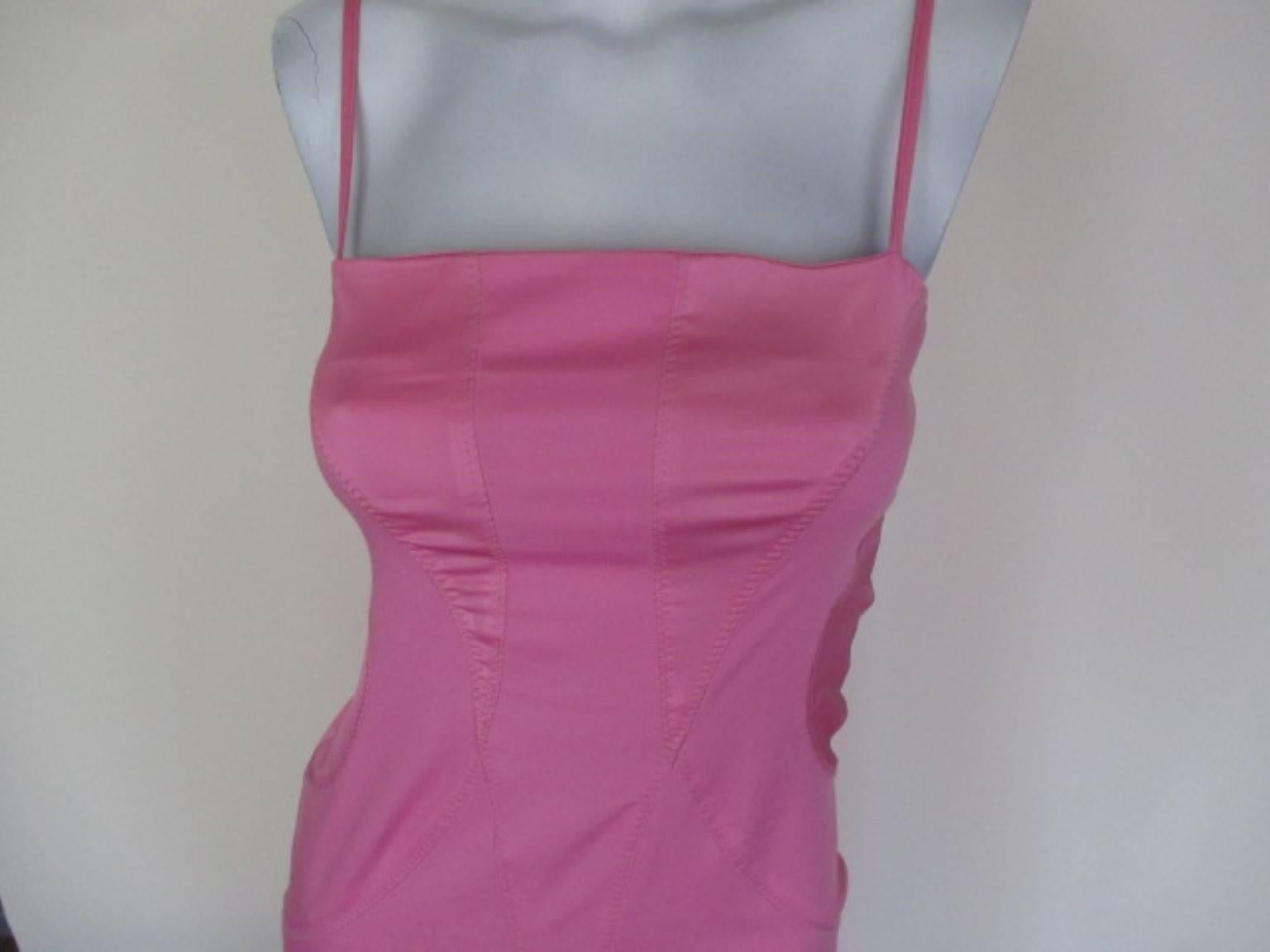 Thierry Mugler Dress

We offer more exclusive vintage items, view our frontstore

This vintage spaghetti strapped pink tailored mini dress consists of satin inserts as well as cross stitching on both the backside as well as the front side of the