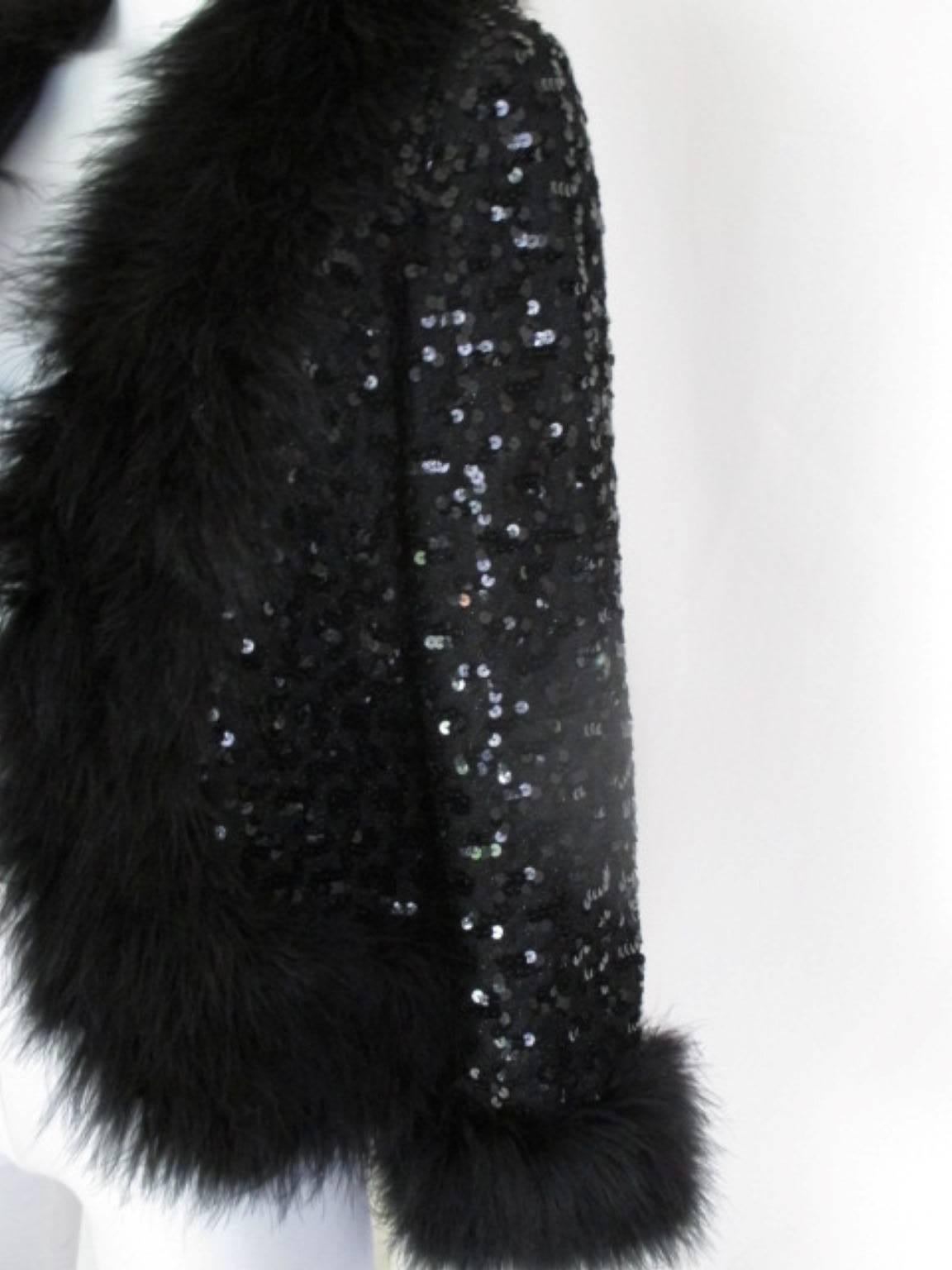 This vintage sequin jacket is trimmed with black marabou.
From; Lillian Diamond California
Size is about medium, see section measurements.

Please note that vintage items are not new and therefore might have minor imperfections.